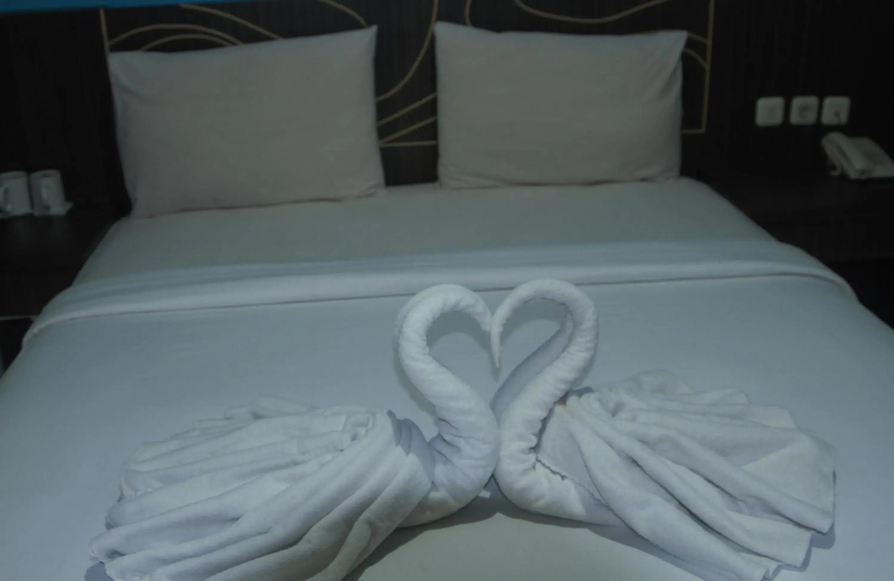 Bed in Nutana Hotel Lombok