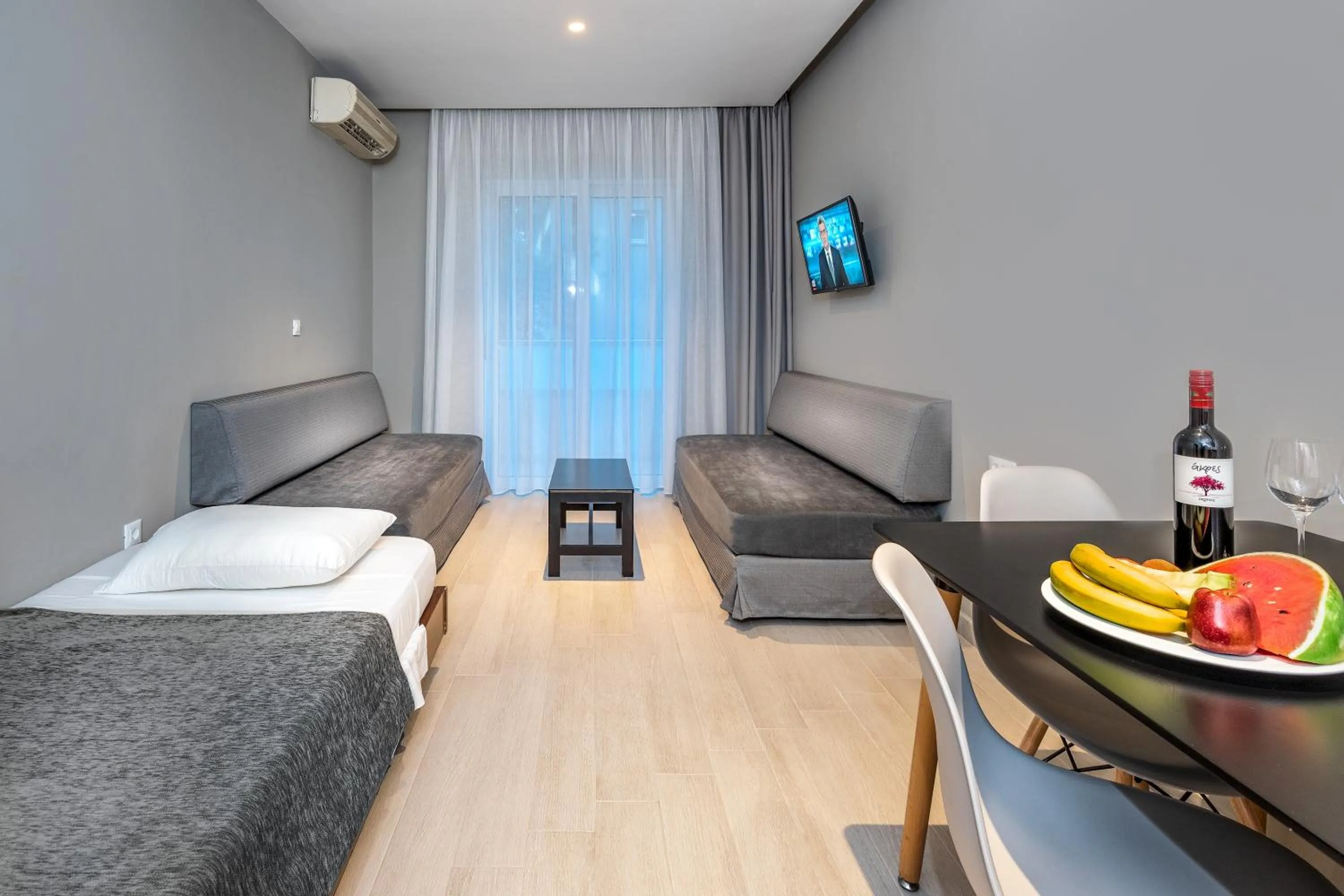 Living room, Bed in Sunday Hotel