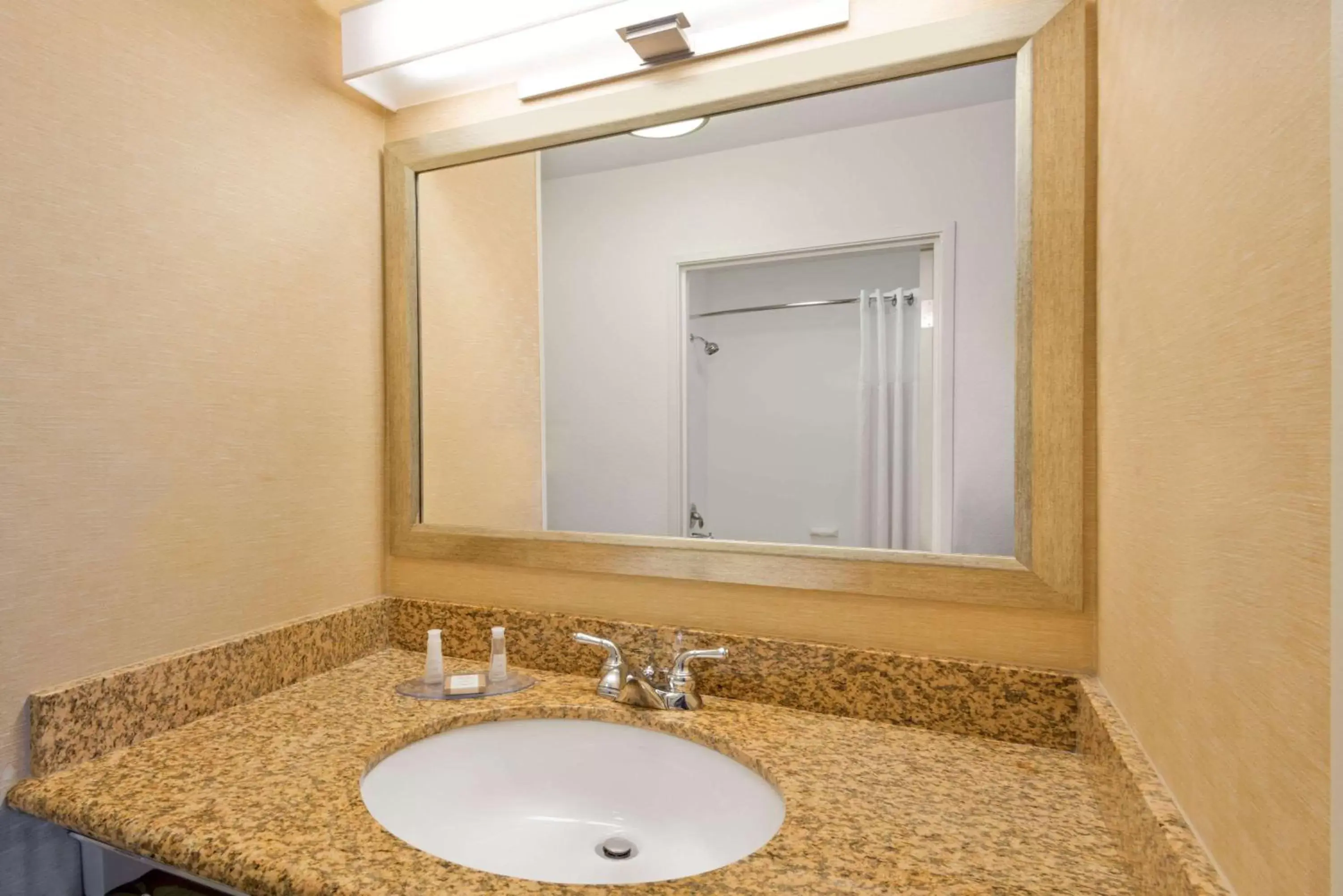 Bathroom in Baymont by Wyndham Denver International Airport
