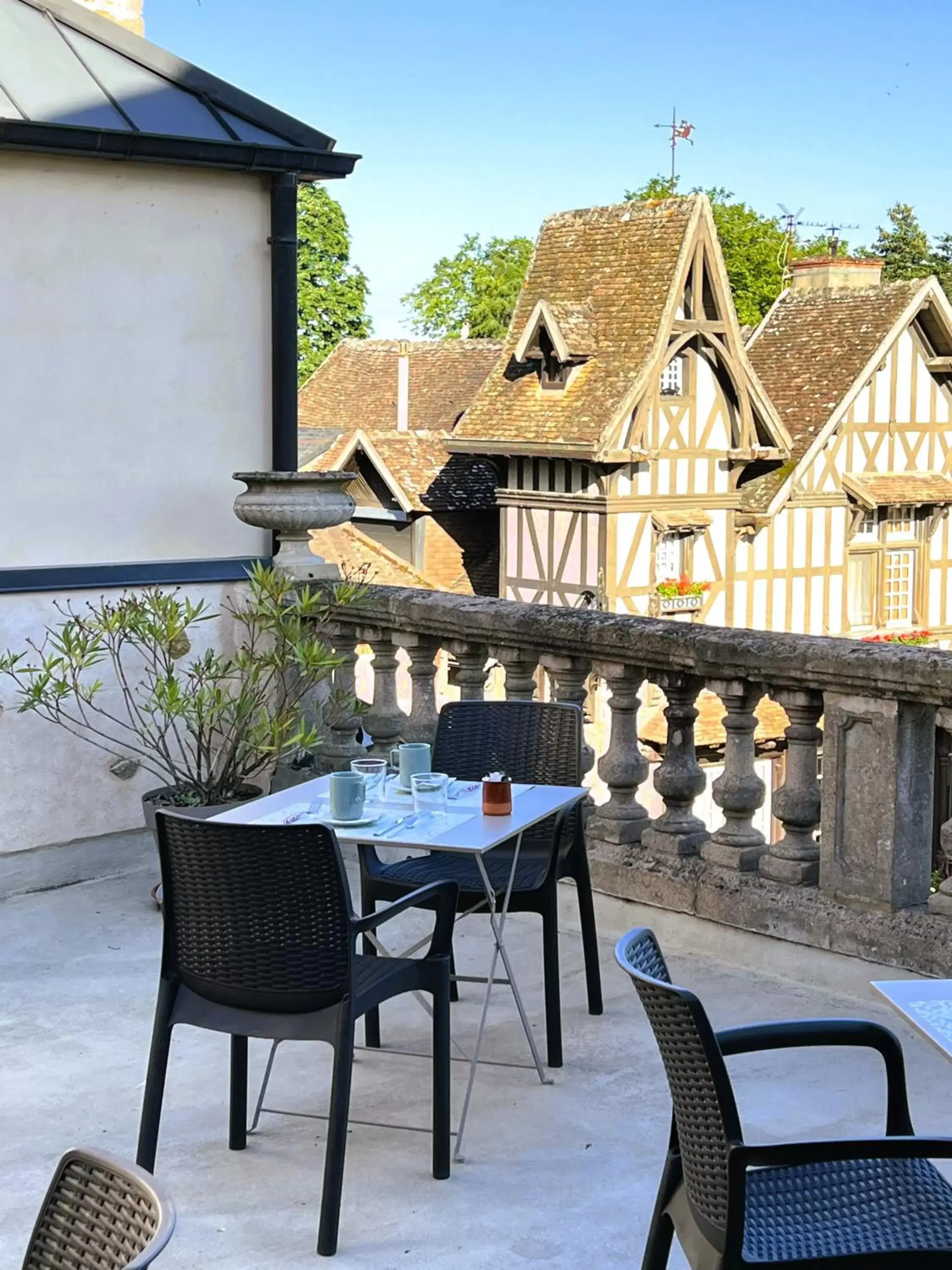 Patio in Logis Hotel La Tourelle du Beffroi