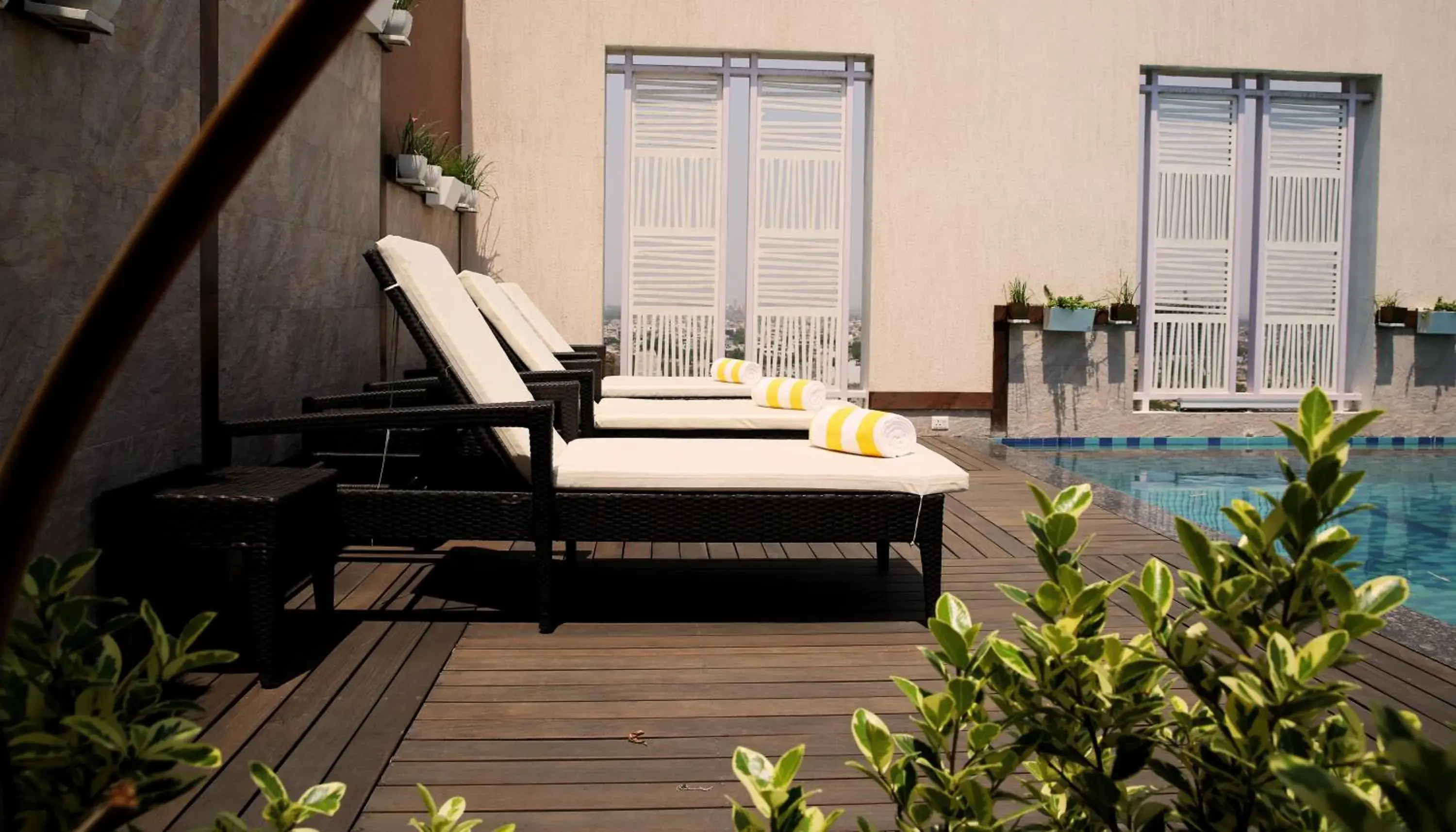 Pool view, Patio/Outdoor Area in Golden Tulip Vasundhara Hotel and Suites