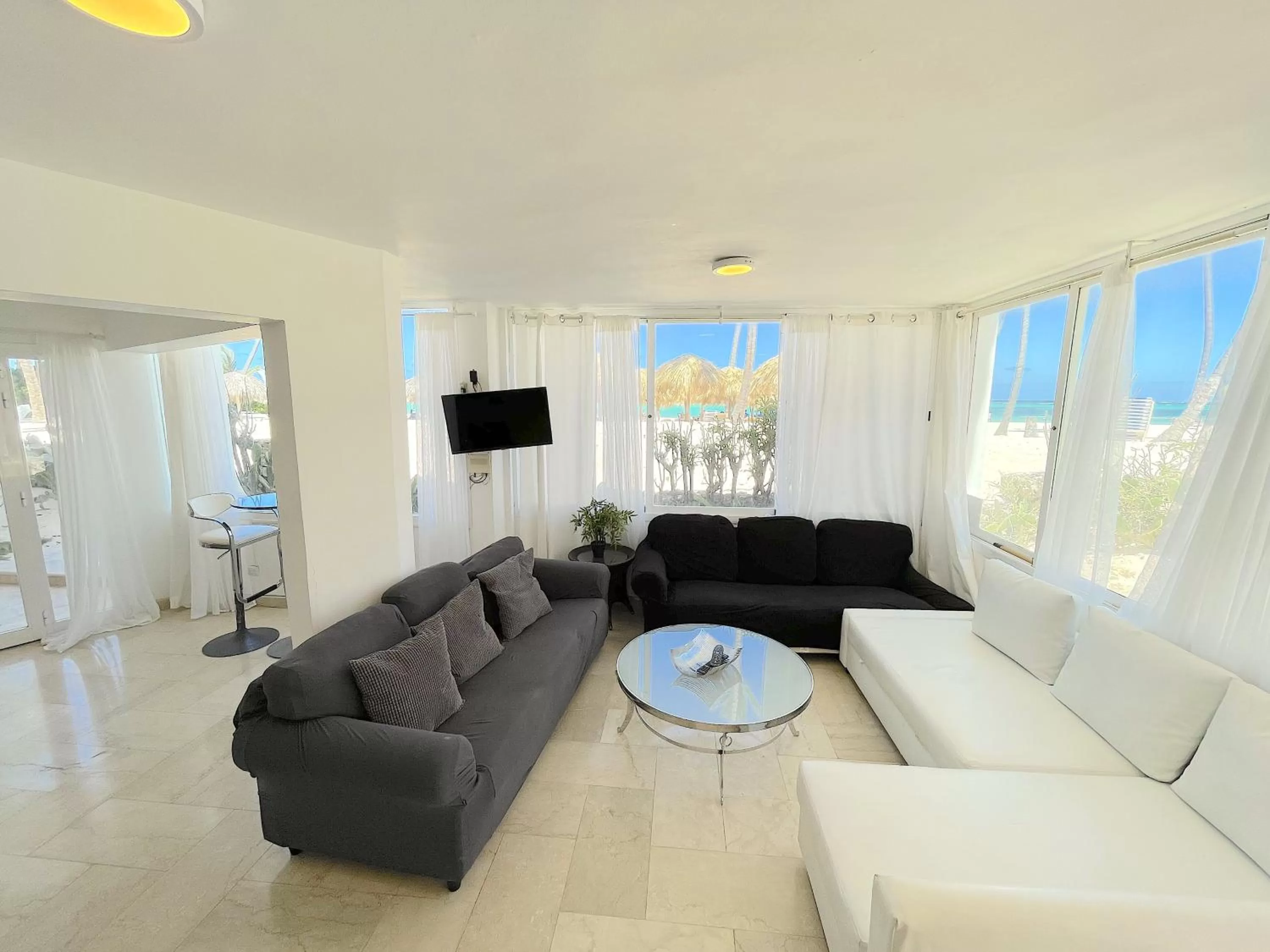 TV and multimedia, Seating Area in BEACH Condo-HOTEL with VILLAS & PRIVATE Apartments WIFI BBQ Beach CLUB & SPA