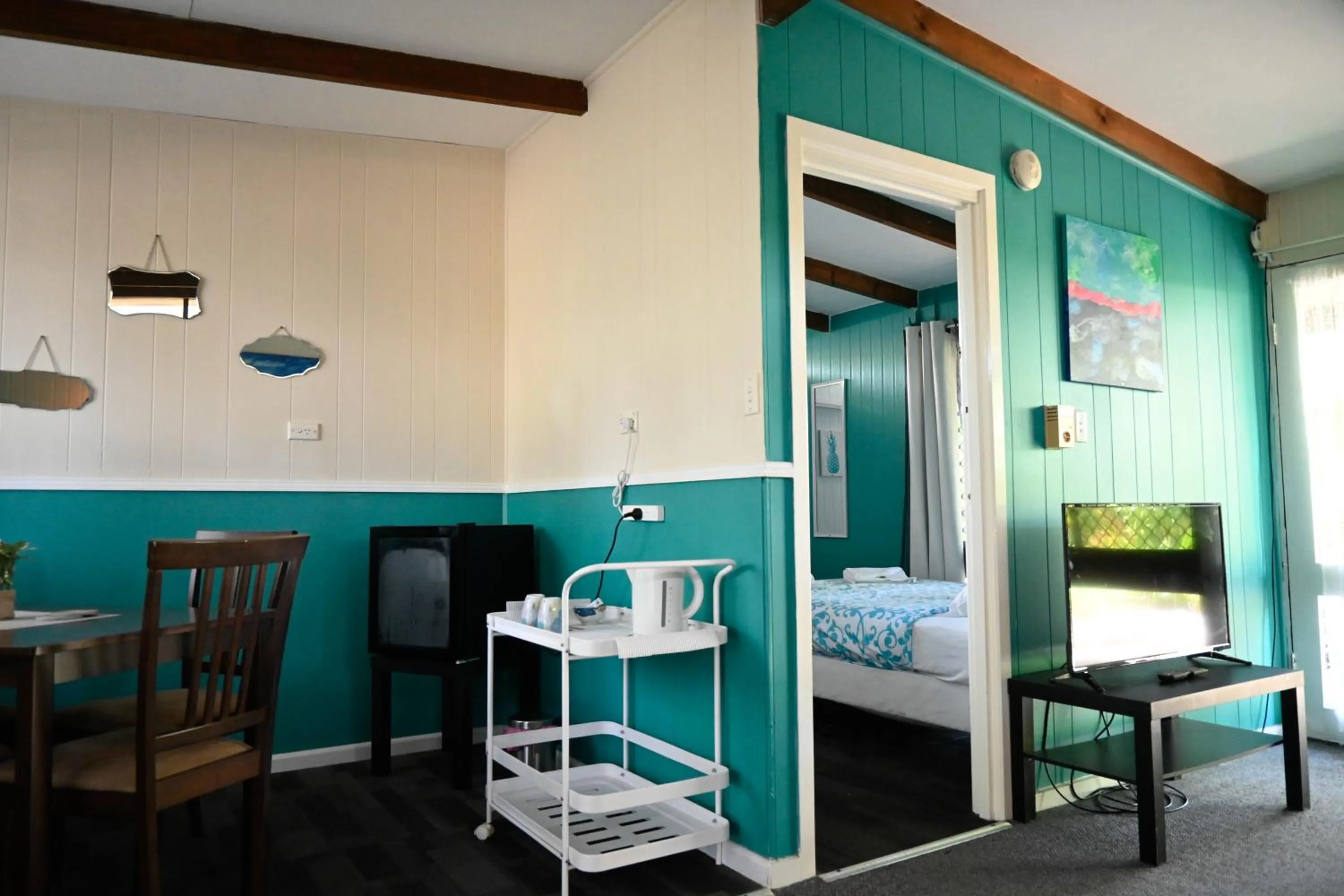 Bed in Colonial Village Resort