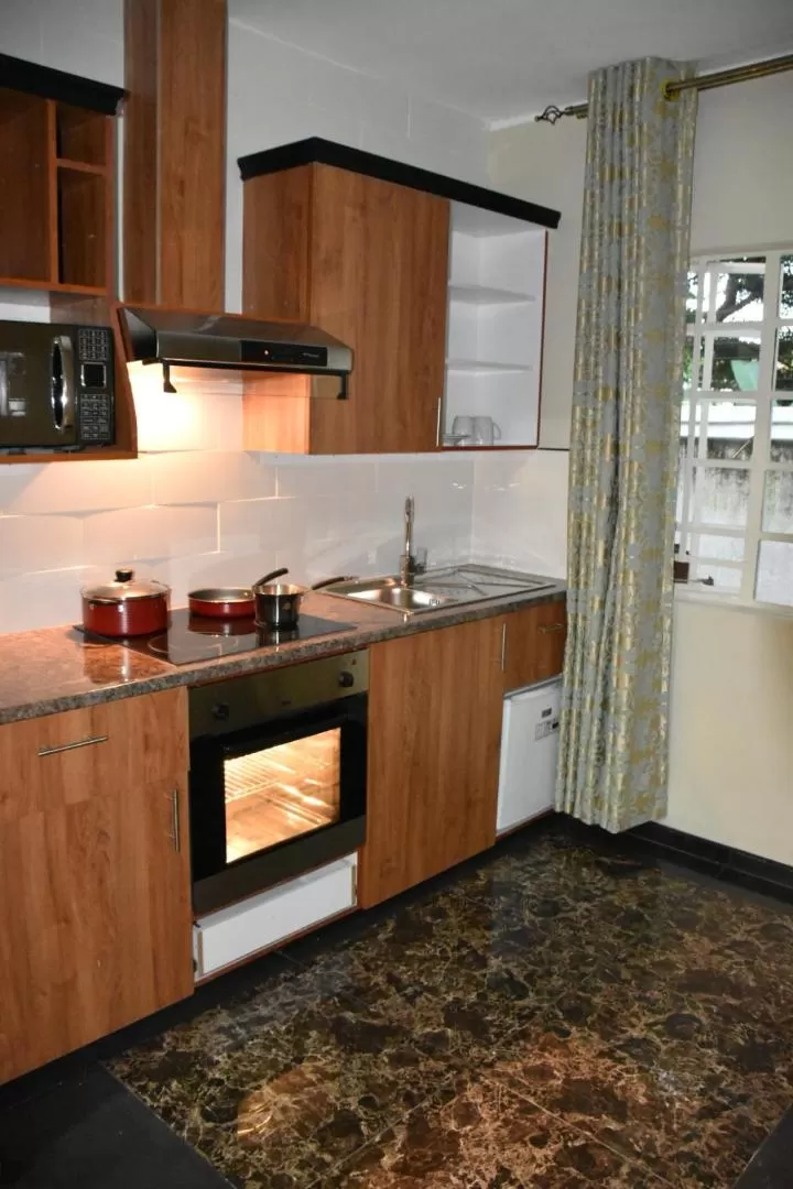 Kitchen or kitchenette in Annavilla7 Lilongwe hotel