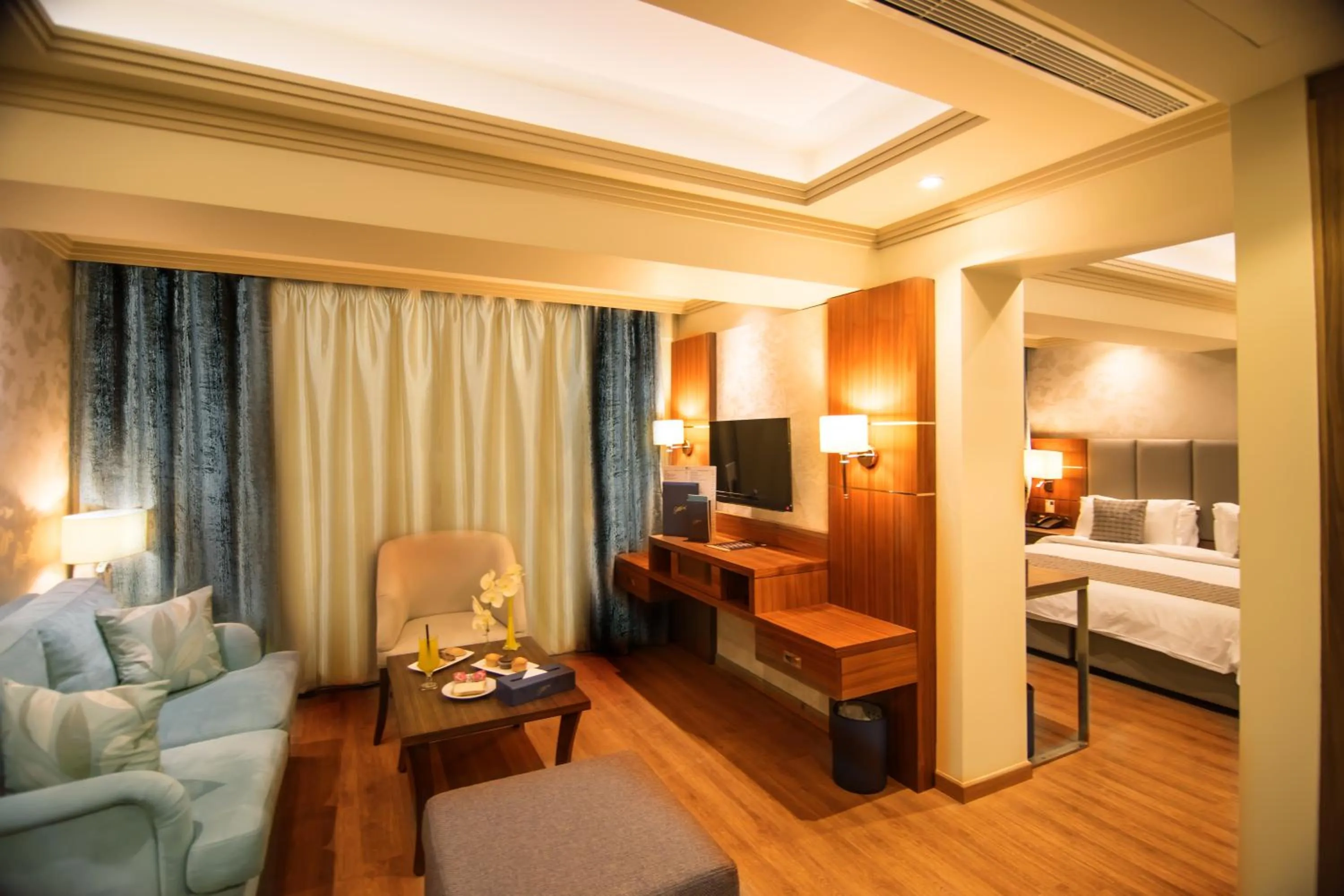 Living room, Bed in Gems Hotel