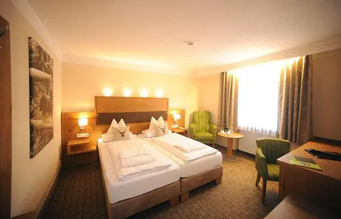 Photo of the whole room, Bed in Ferienhotel Hubertus