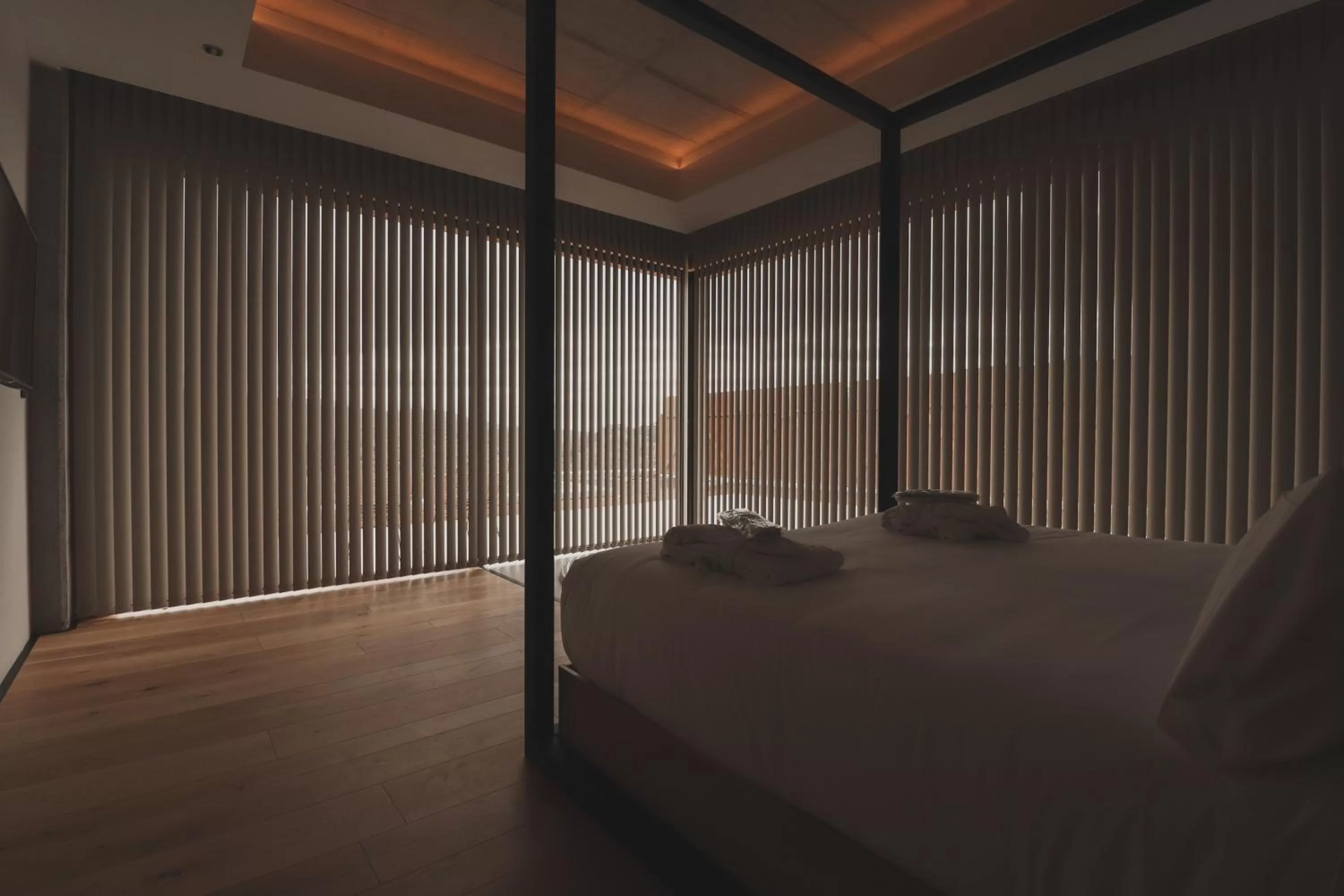 Bed in Atmos Hotel Boutique