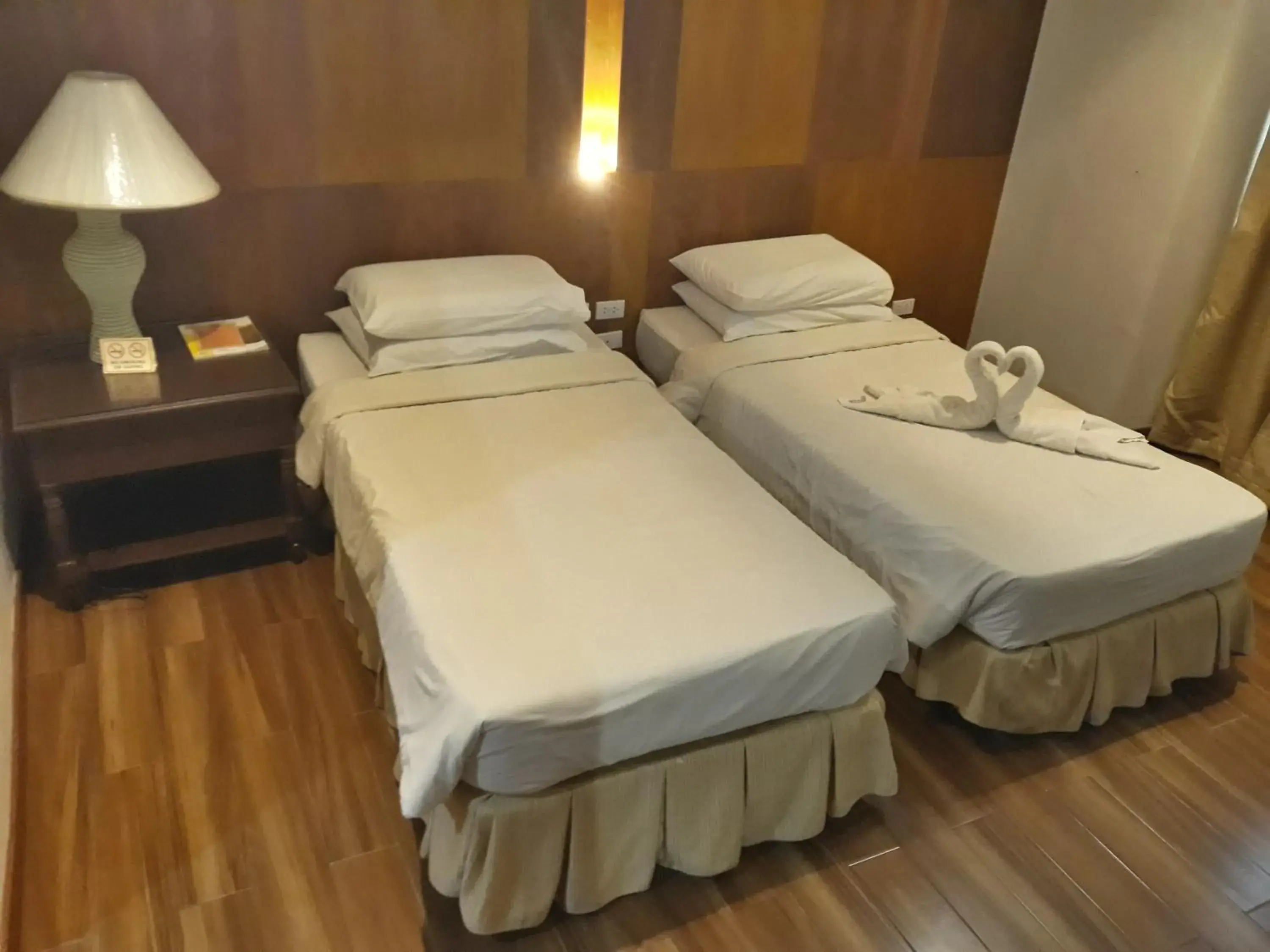 Bed in La Fiesta Hotel