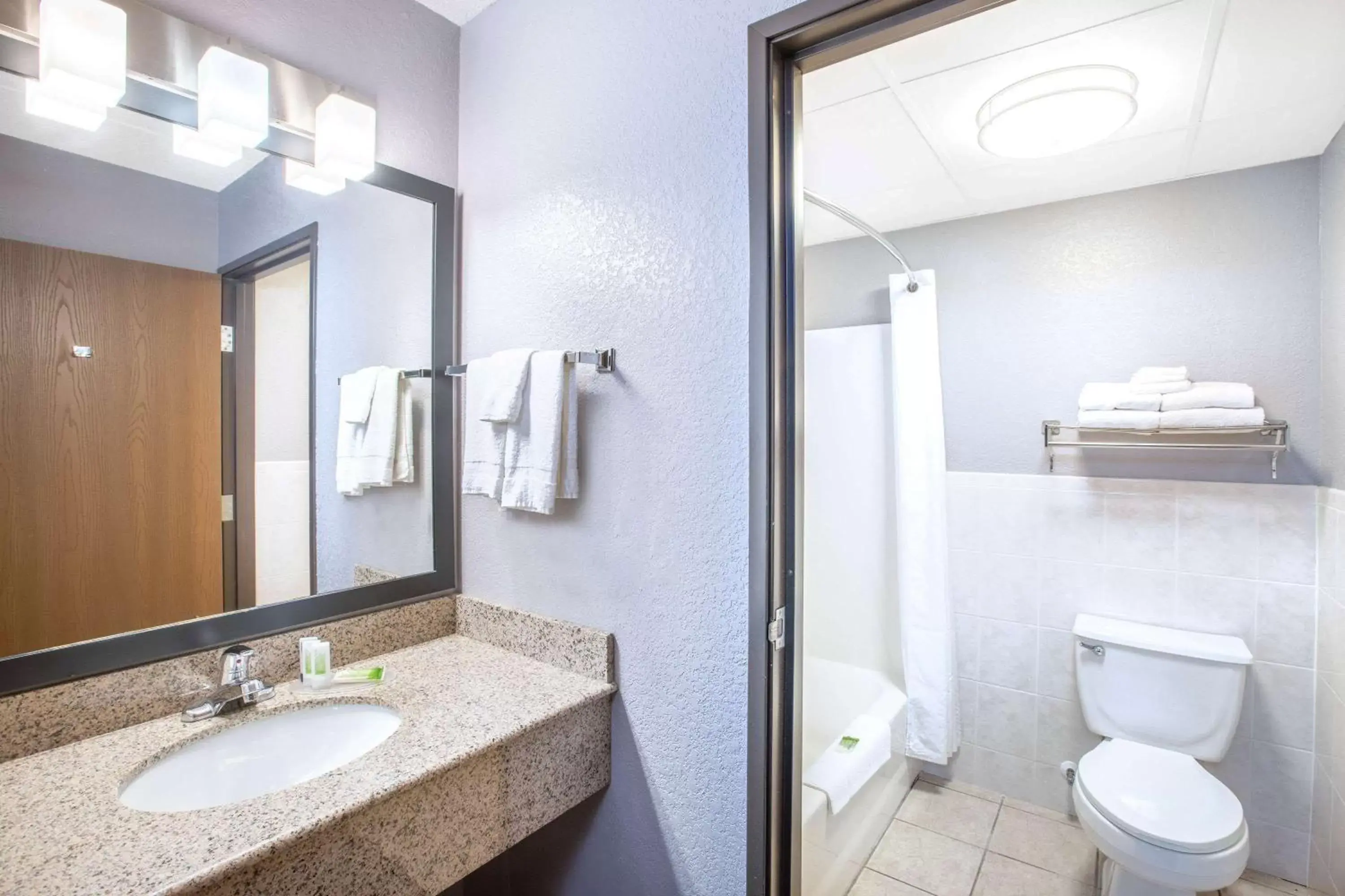 Bathroom in AmericInn by Wyndham Ankeny/Des Moines