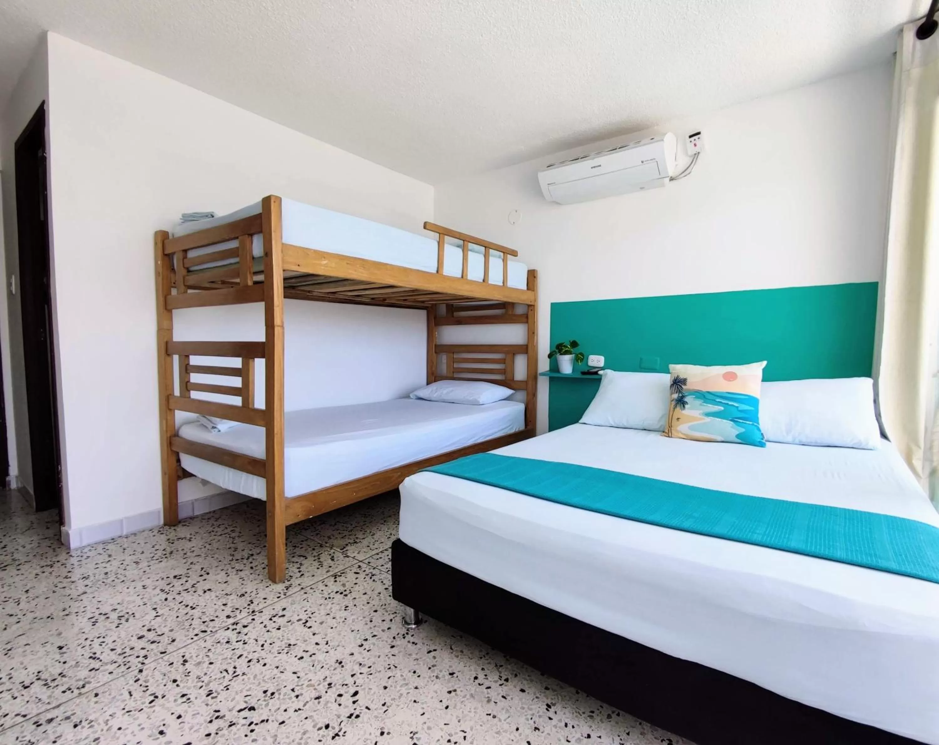 Bed in Bona Vida Hotel