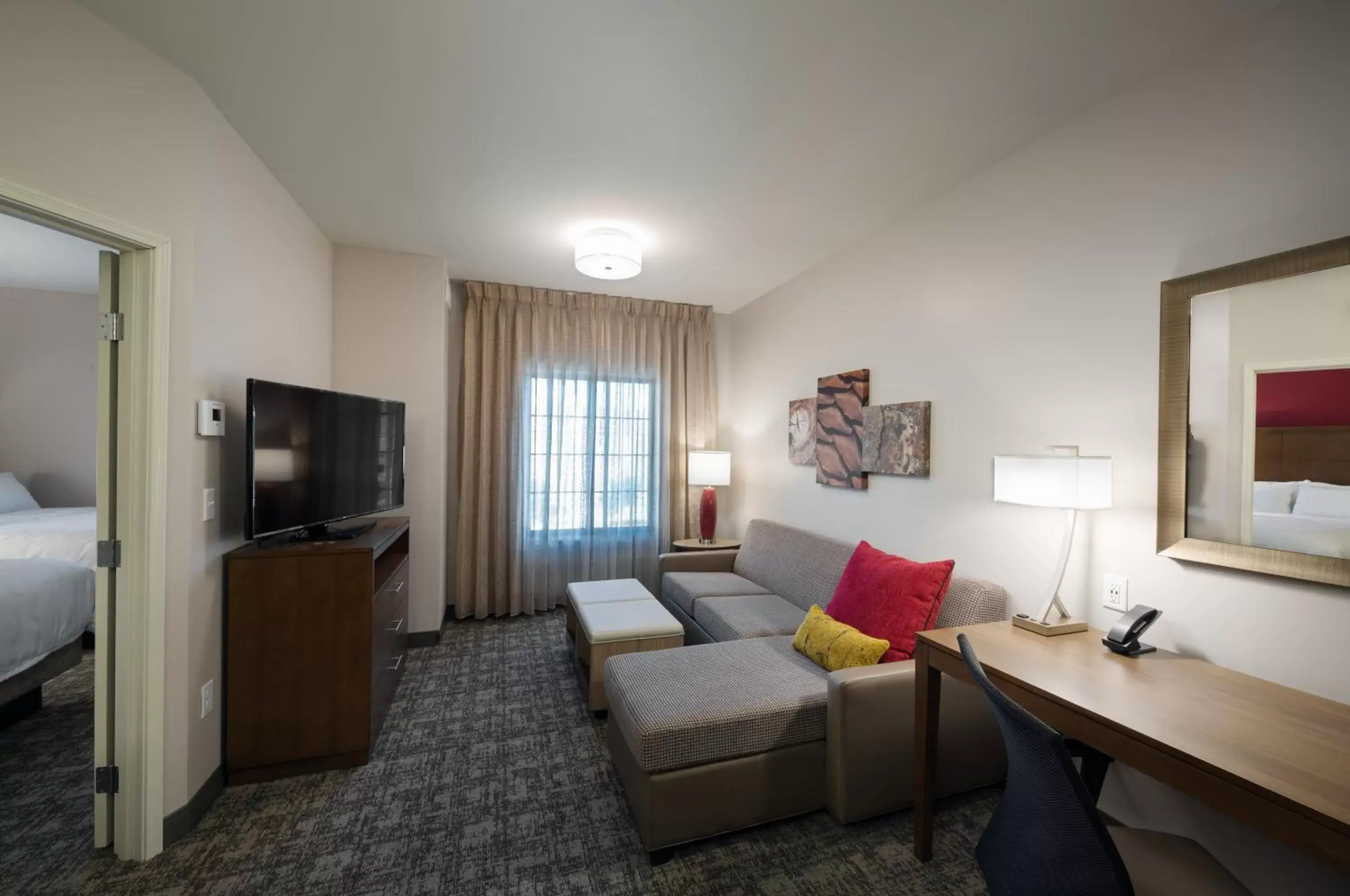 Bedroom, Seating Area in Staybridge Suites - Phoenix – Biltmore Area, an IHG Hotel
