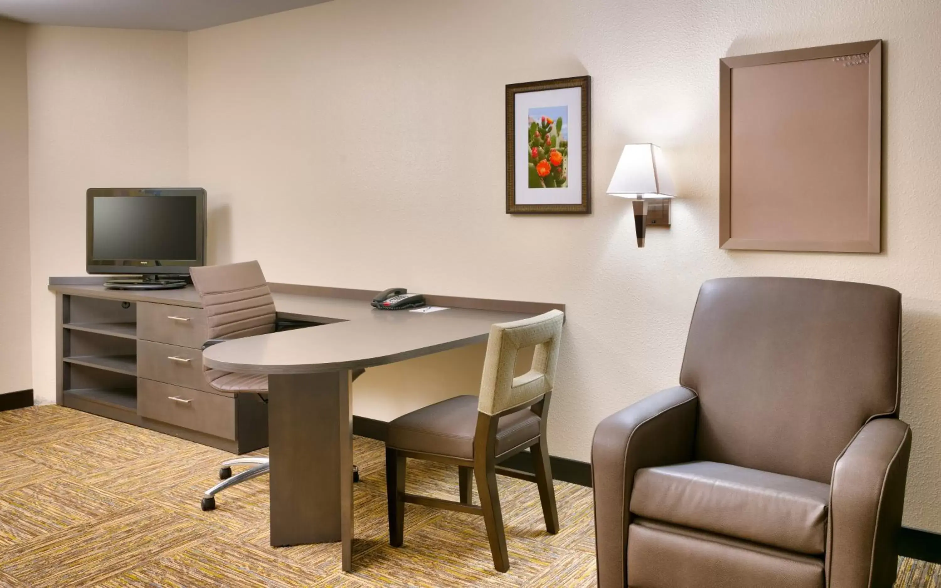 Photo of the whole room, TV/Entertainment Center in Candlewood Suites Plano East, an IHG Hotel