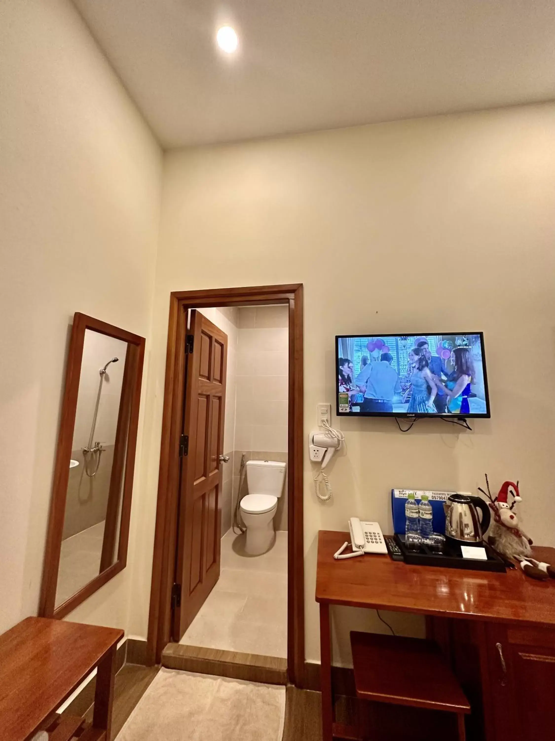 Toilet, TV/Entertainment Center in Nam Xuan Premium Hotel