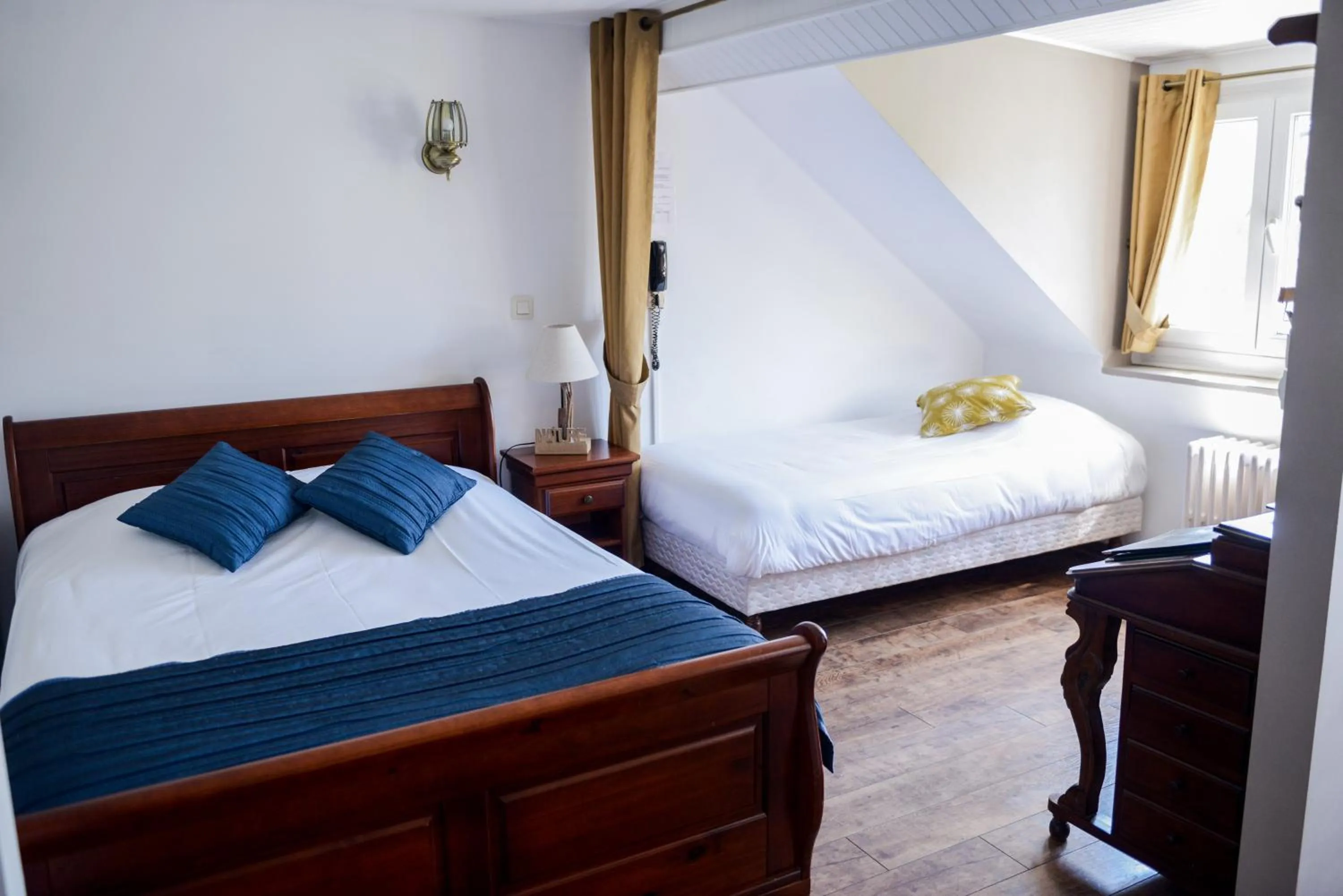 Bed in Logis Le Saint Hubert