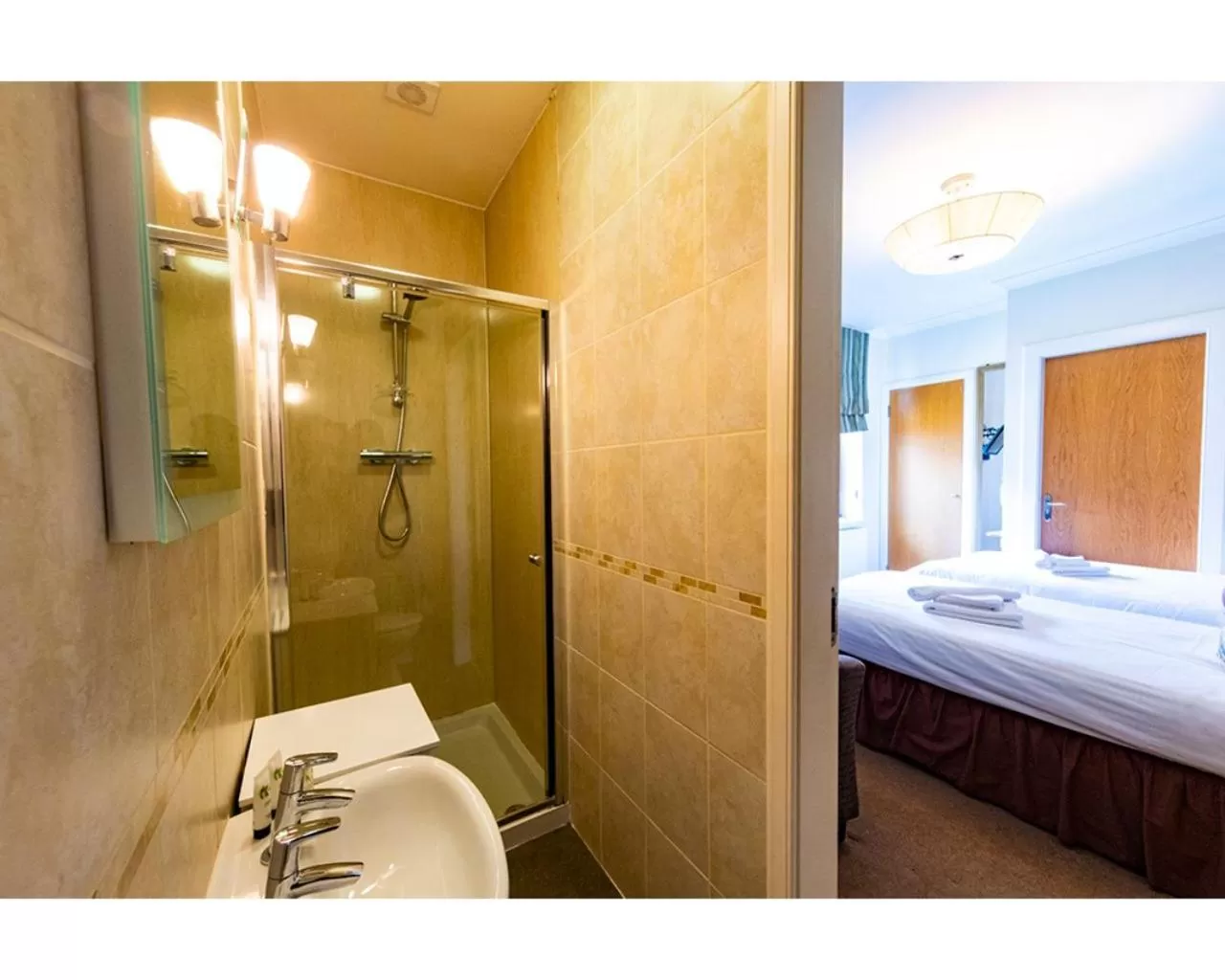 Bathroom, Bed in Crown Hotel