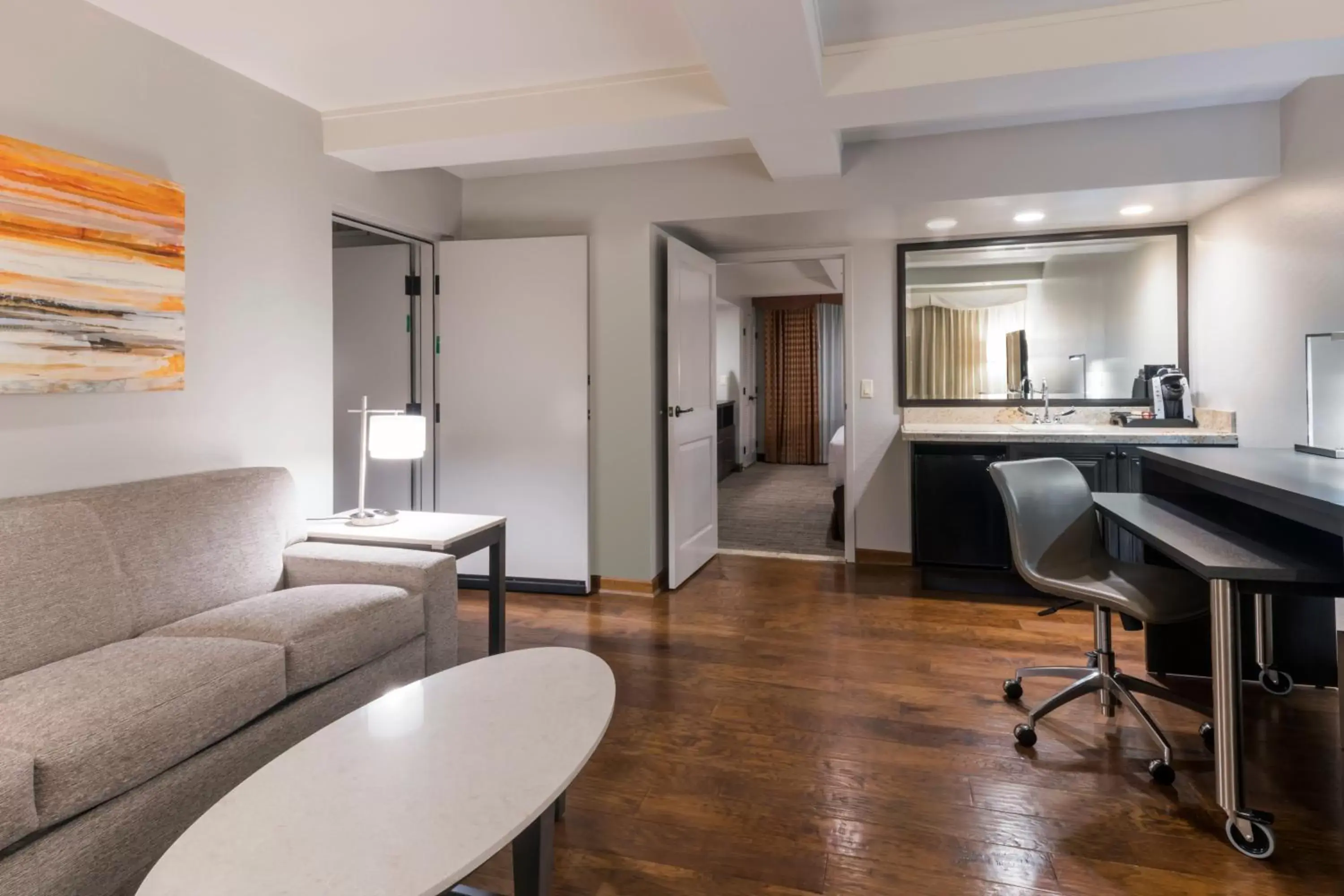 Bedroom, Seating Area in Holiday Inn and Suites Phoenix Airport North, an IHG Hotel