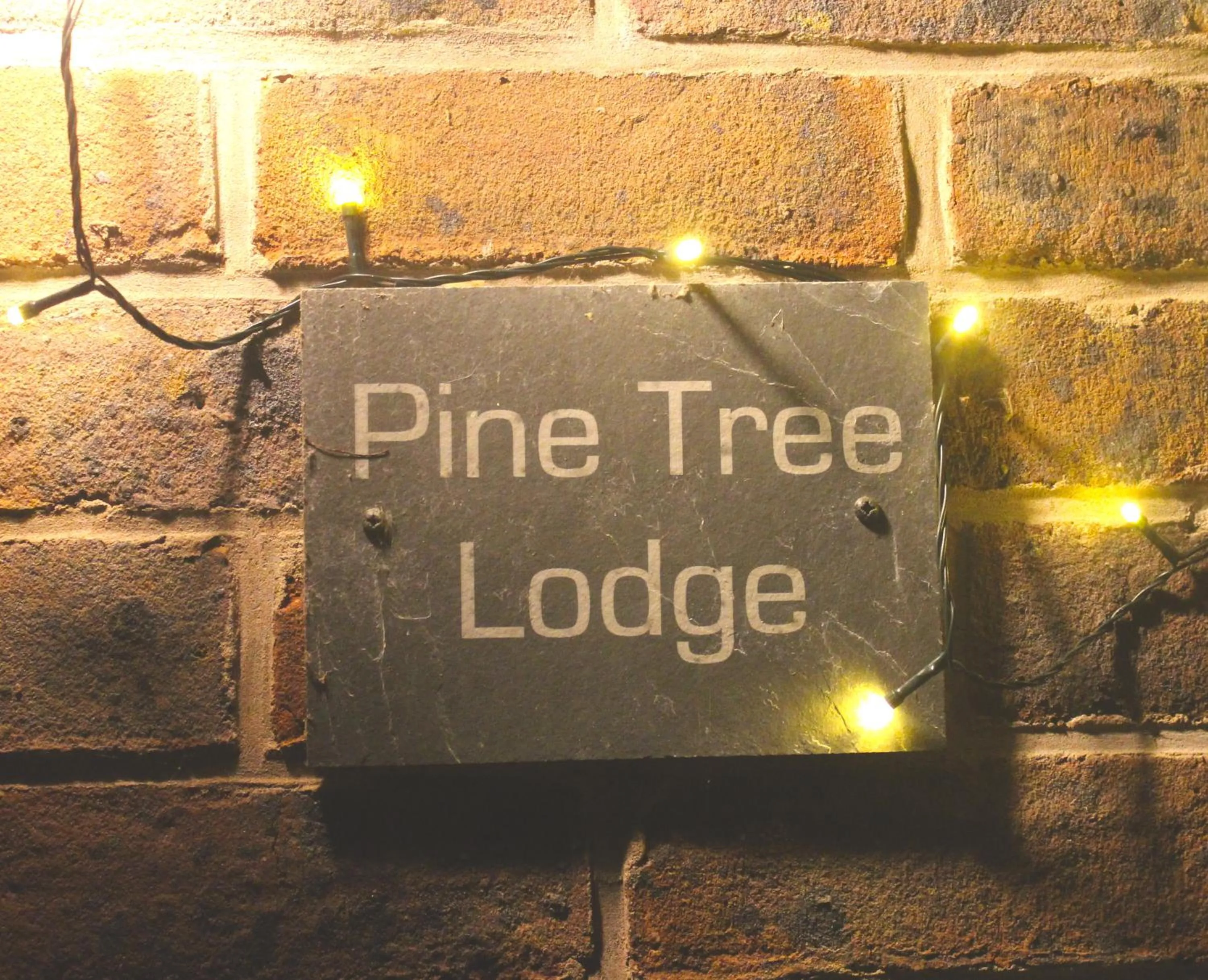 Property logo or sign in Pine Tree Lodge, Bridgnorth