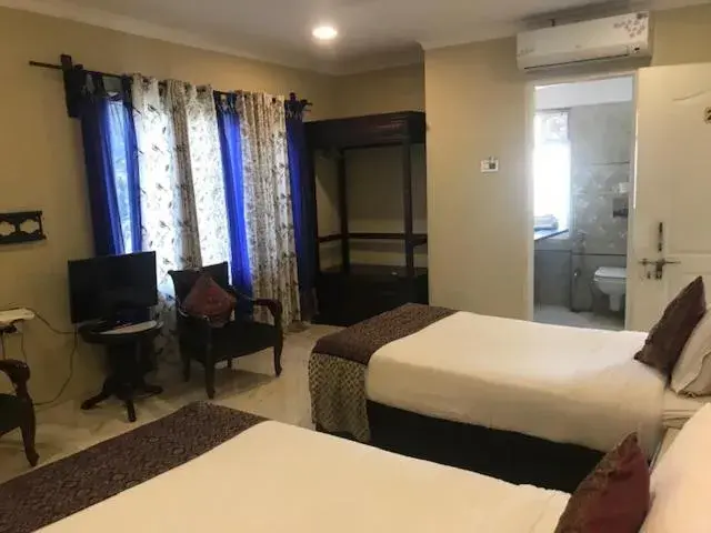 Bed in Hotel Pratap Palace