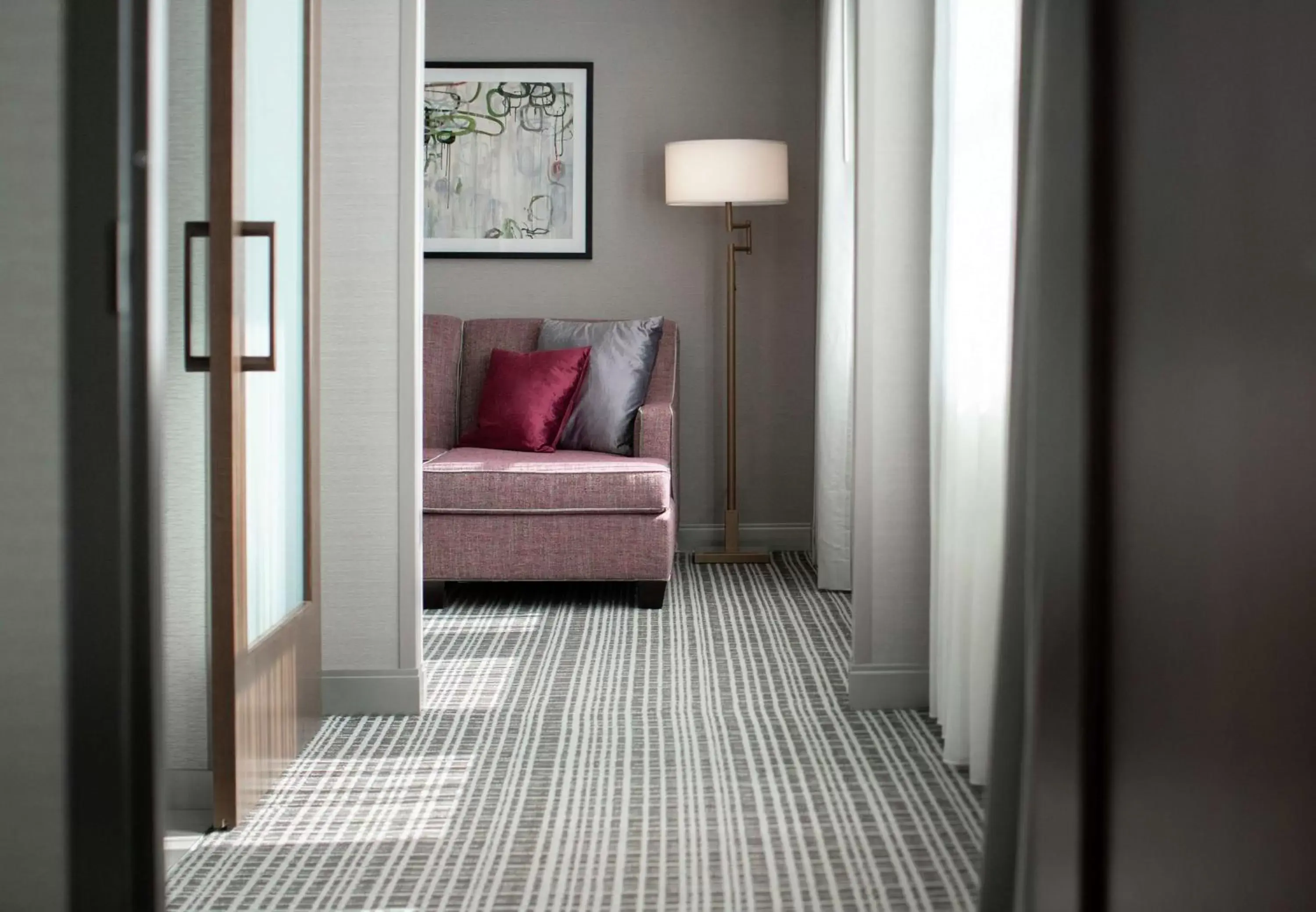 Living room in The Axis Moline Hotel, Tapestry Collection By Hilton Living room in The Axis Moline Hotel, Tapestry Collection By Hilton