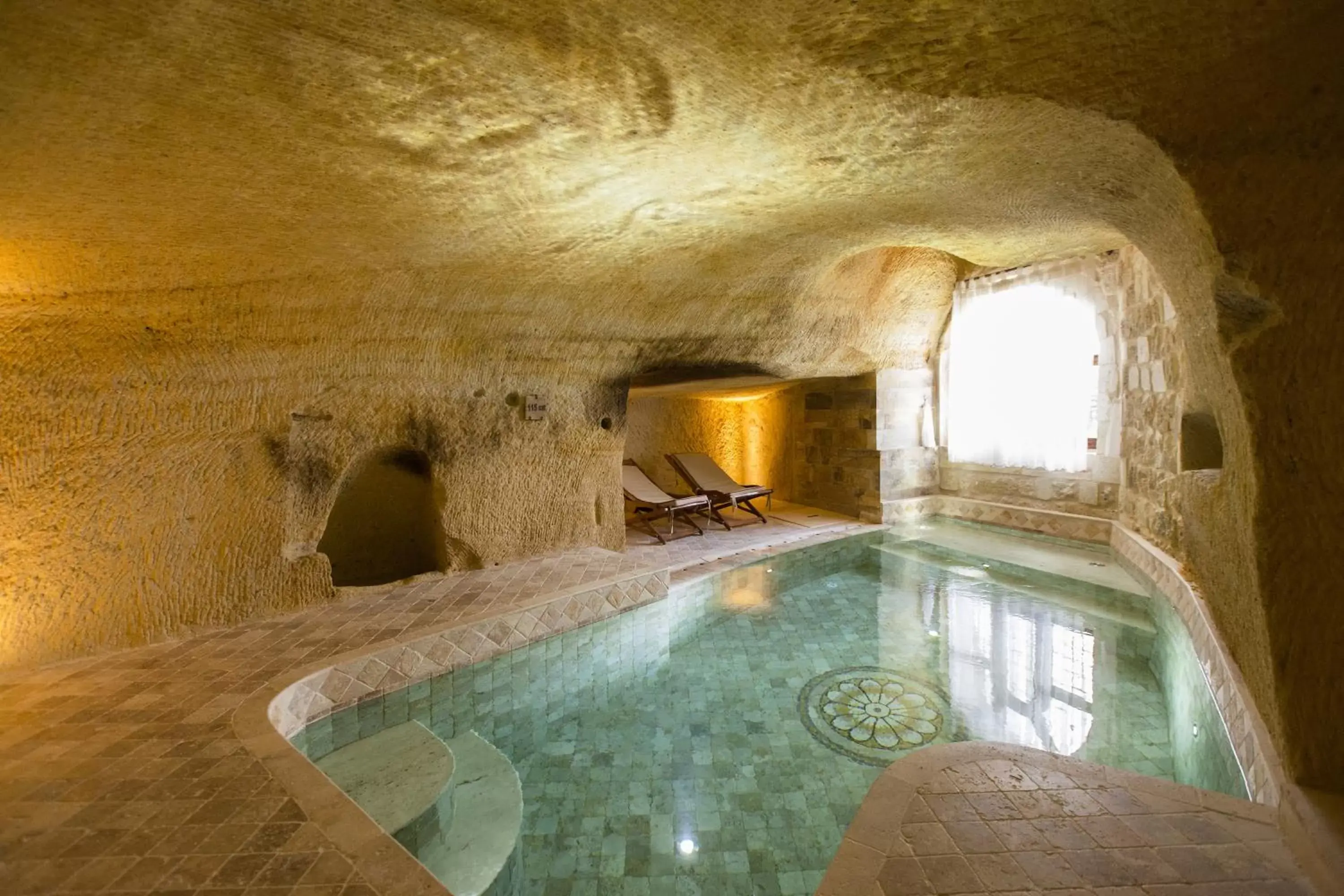 Bed, Swimming Pool in Kayakapi Premium Caves Cappadocia