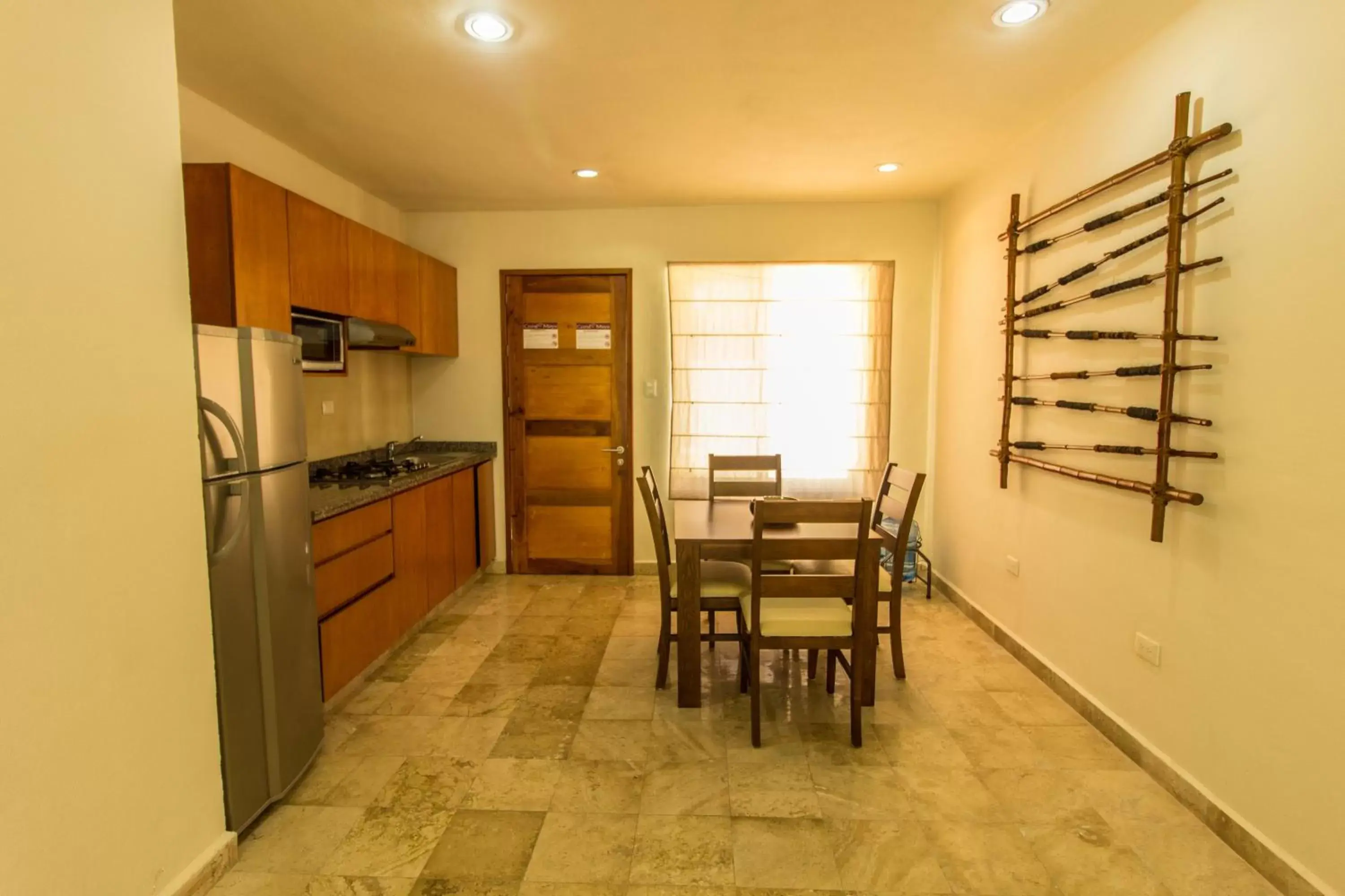 Kitchen or kitchenette, Dining Area in Coral Maya Stay Suites