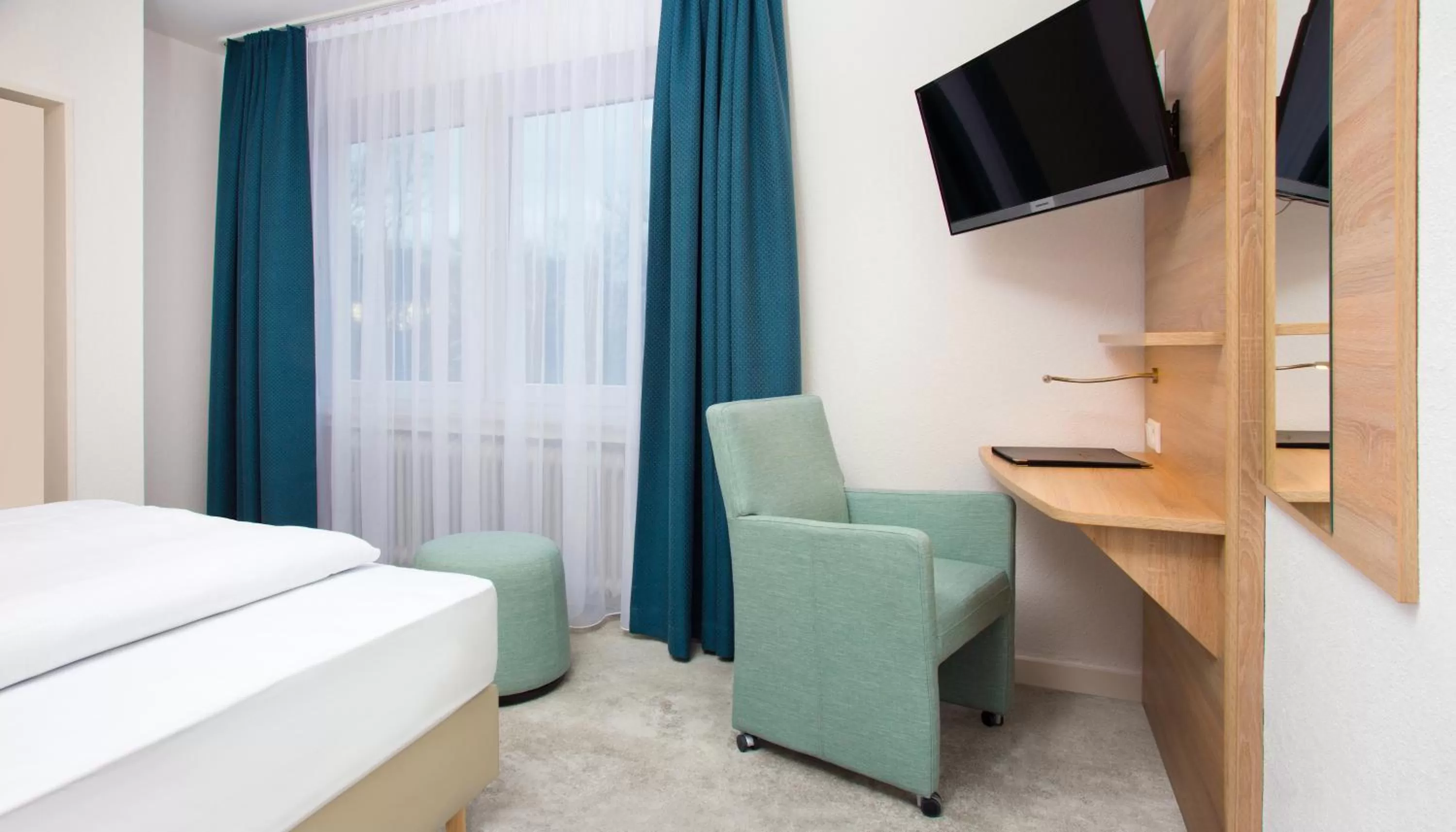 Photo of the whole room, Bed in Parkhotel Lippstadt