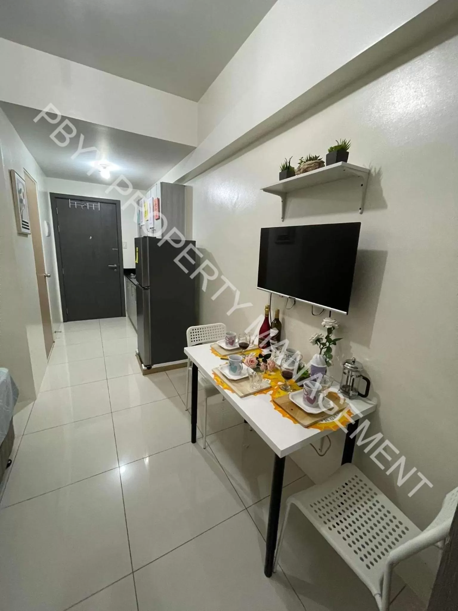 Dining area in Green Residences Staycation by PBYY