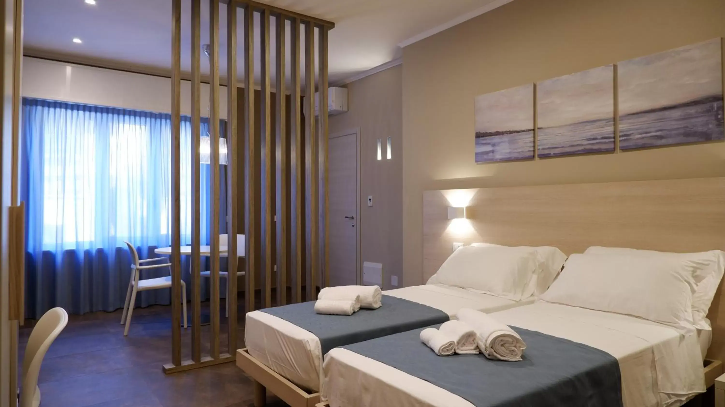 Bed in Pianomare Riviera Apartments and Rooms