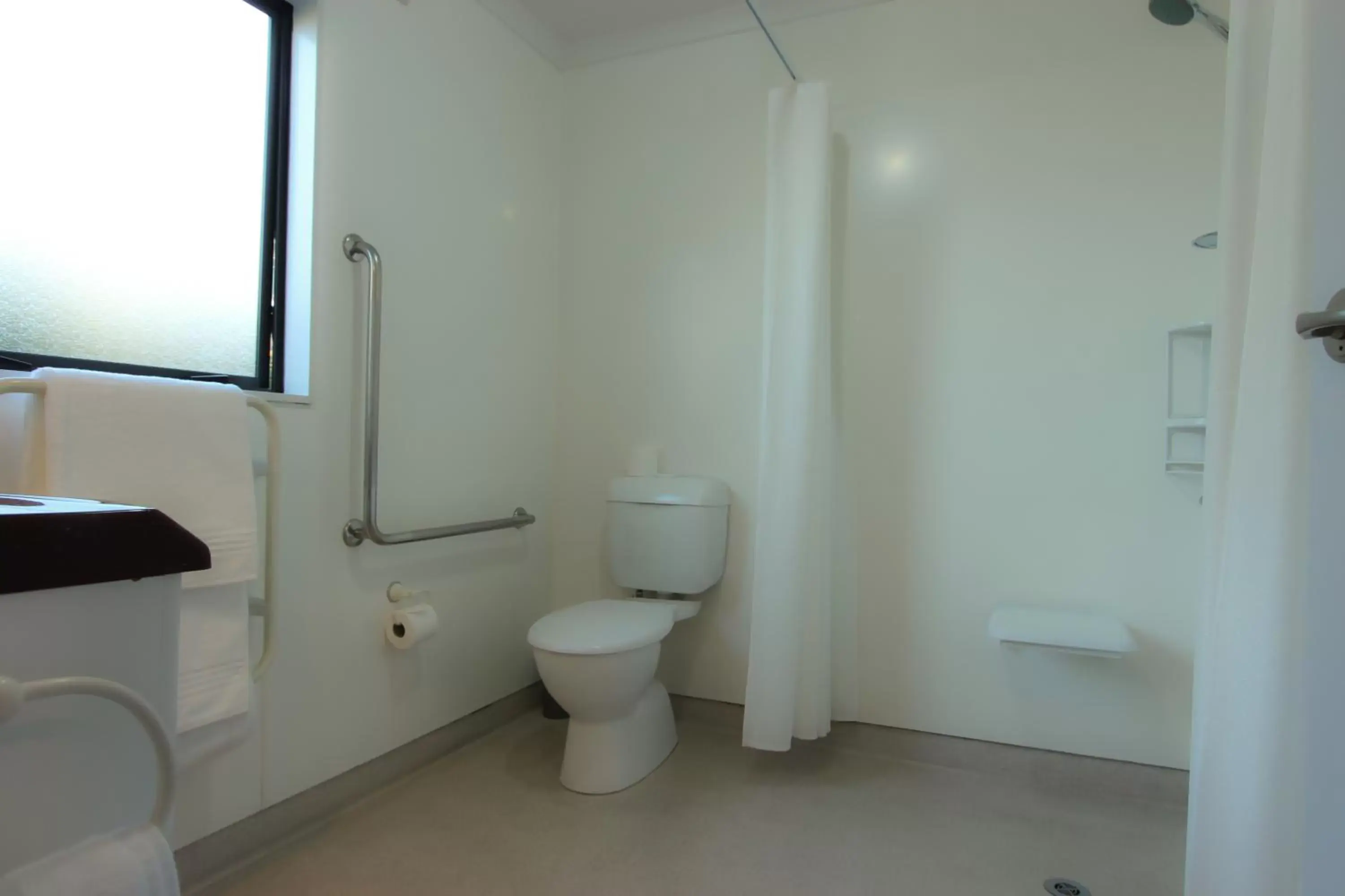 Toilet, Bathroom in BK's Magnolia Motor Lodge