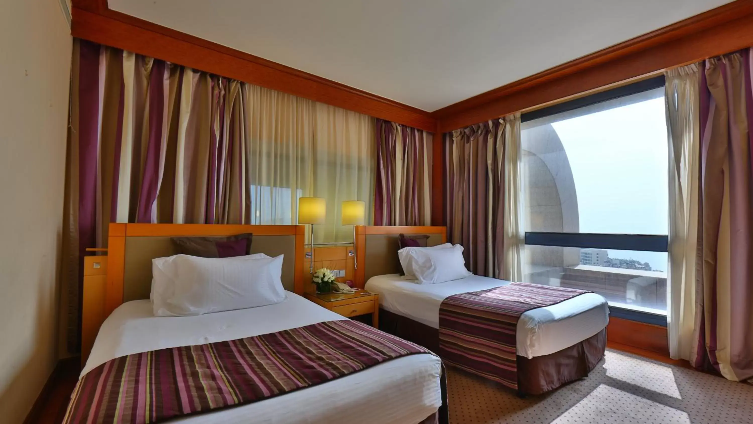 Photo of the whole room, Bed in Crowne Plaza Hamra Beirut, an IHG Hotel