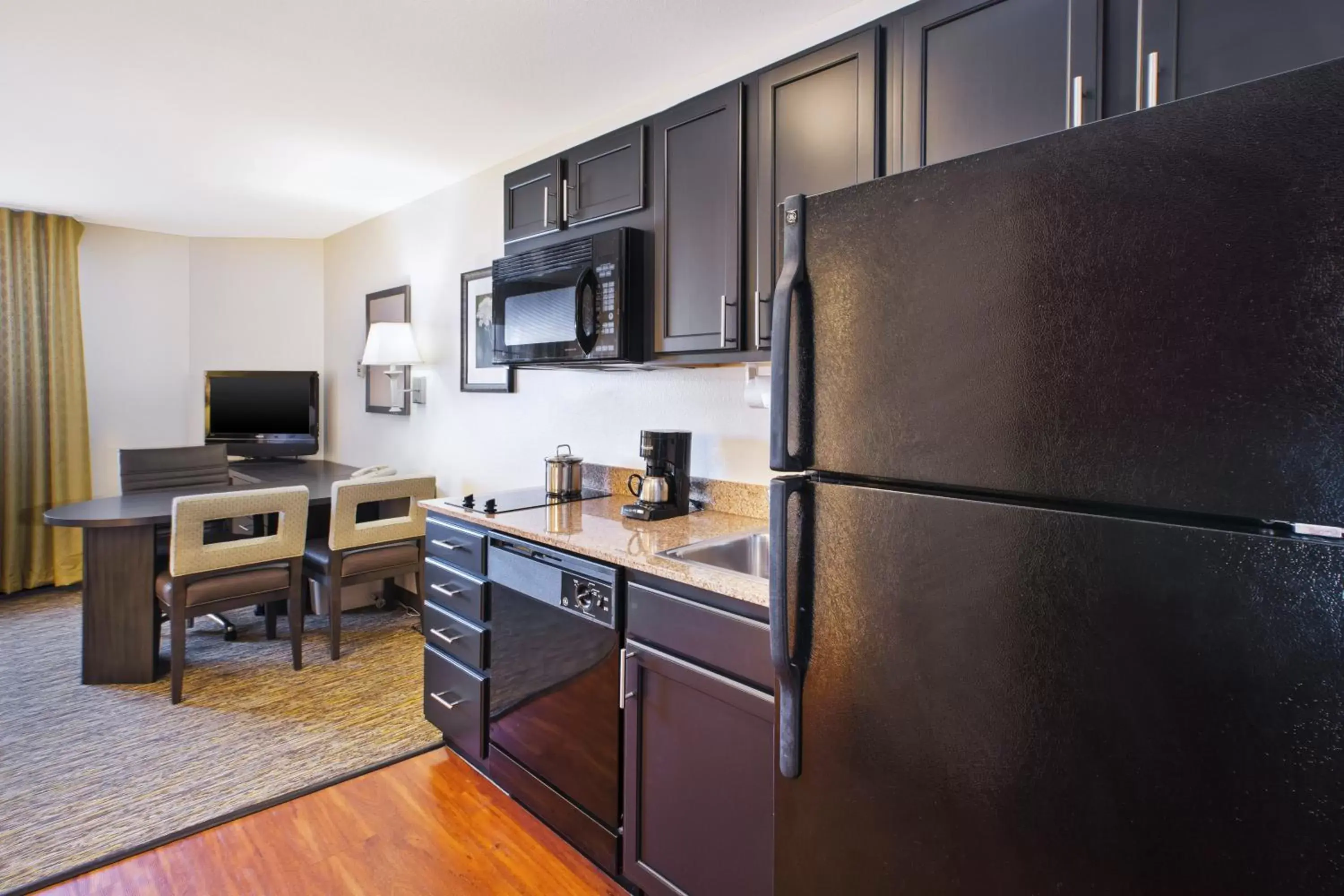 Photo of the whole room, Kitchen/Kitchenette in Candlewood Suites Indianapolis Airport, an IHG Hotel