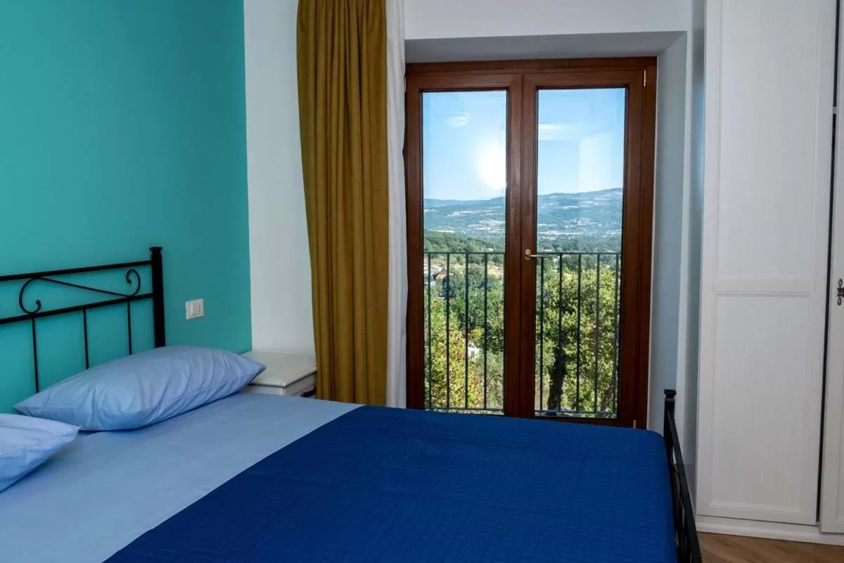 Photo of the whole room, Bed in IL MASCHERONE