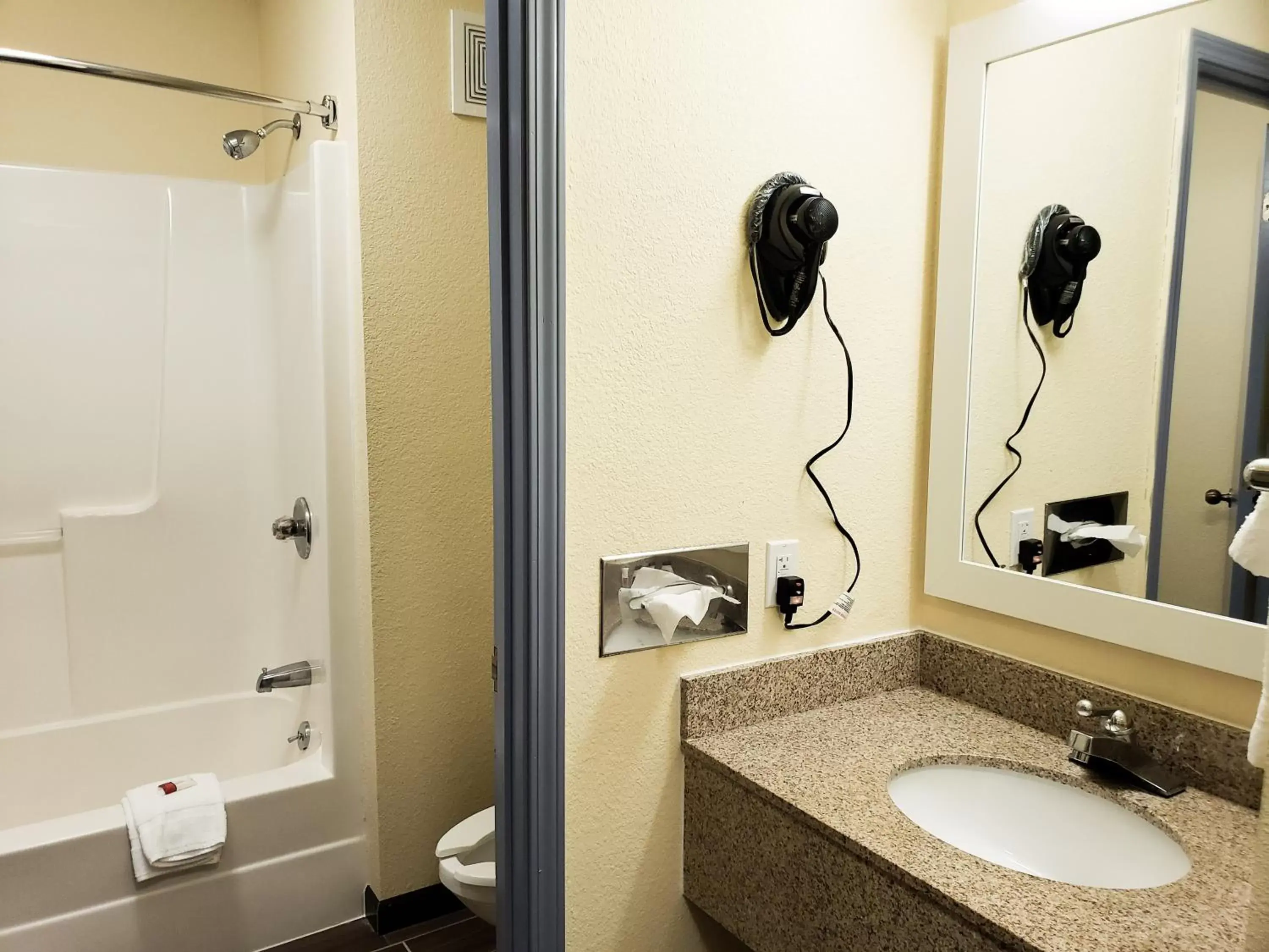 Bathroom in Days Inn & Suites by Wyndham Merrillville