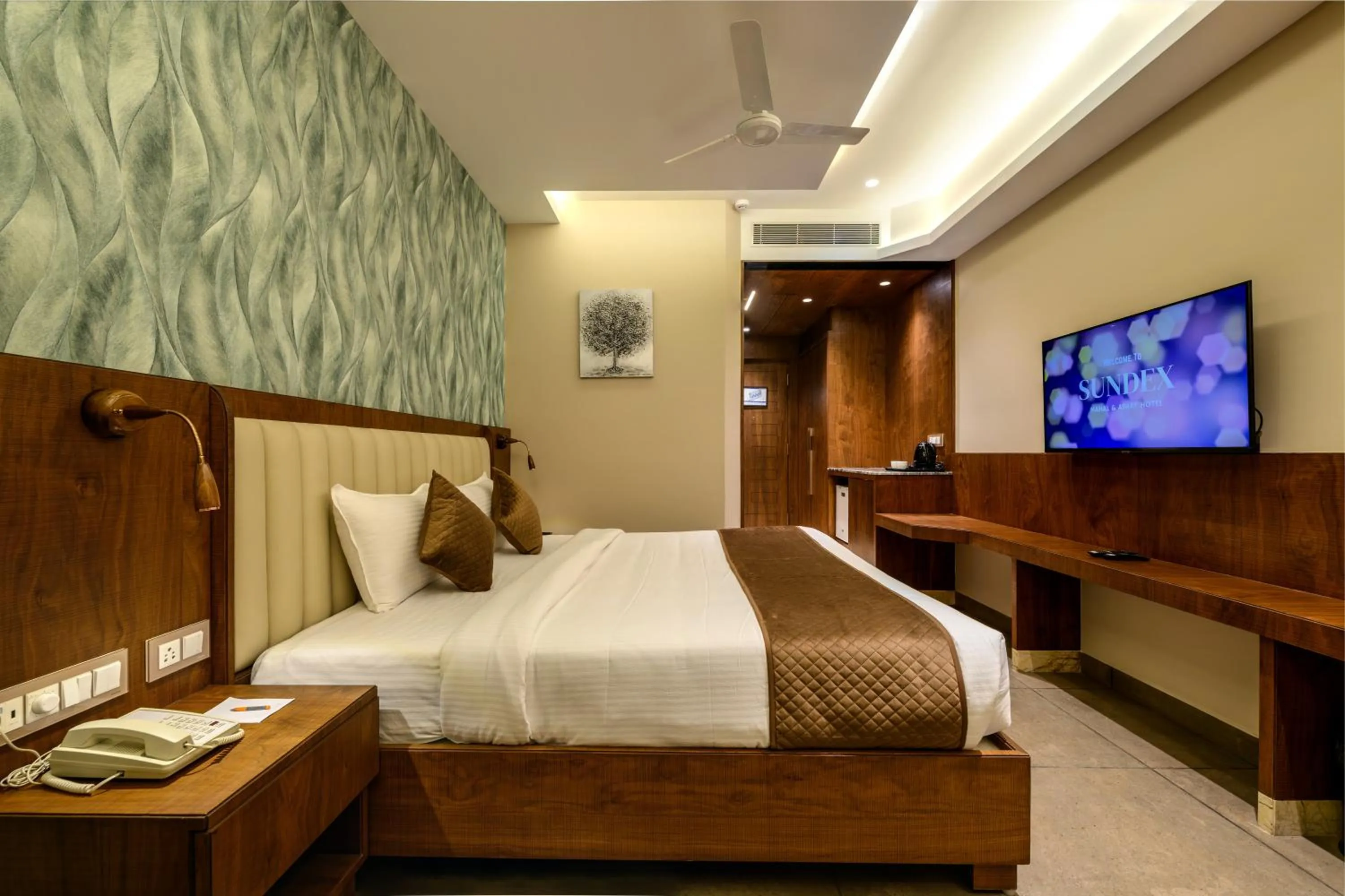 Communal lounge/ TV room, Bed in Sundex Hotel