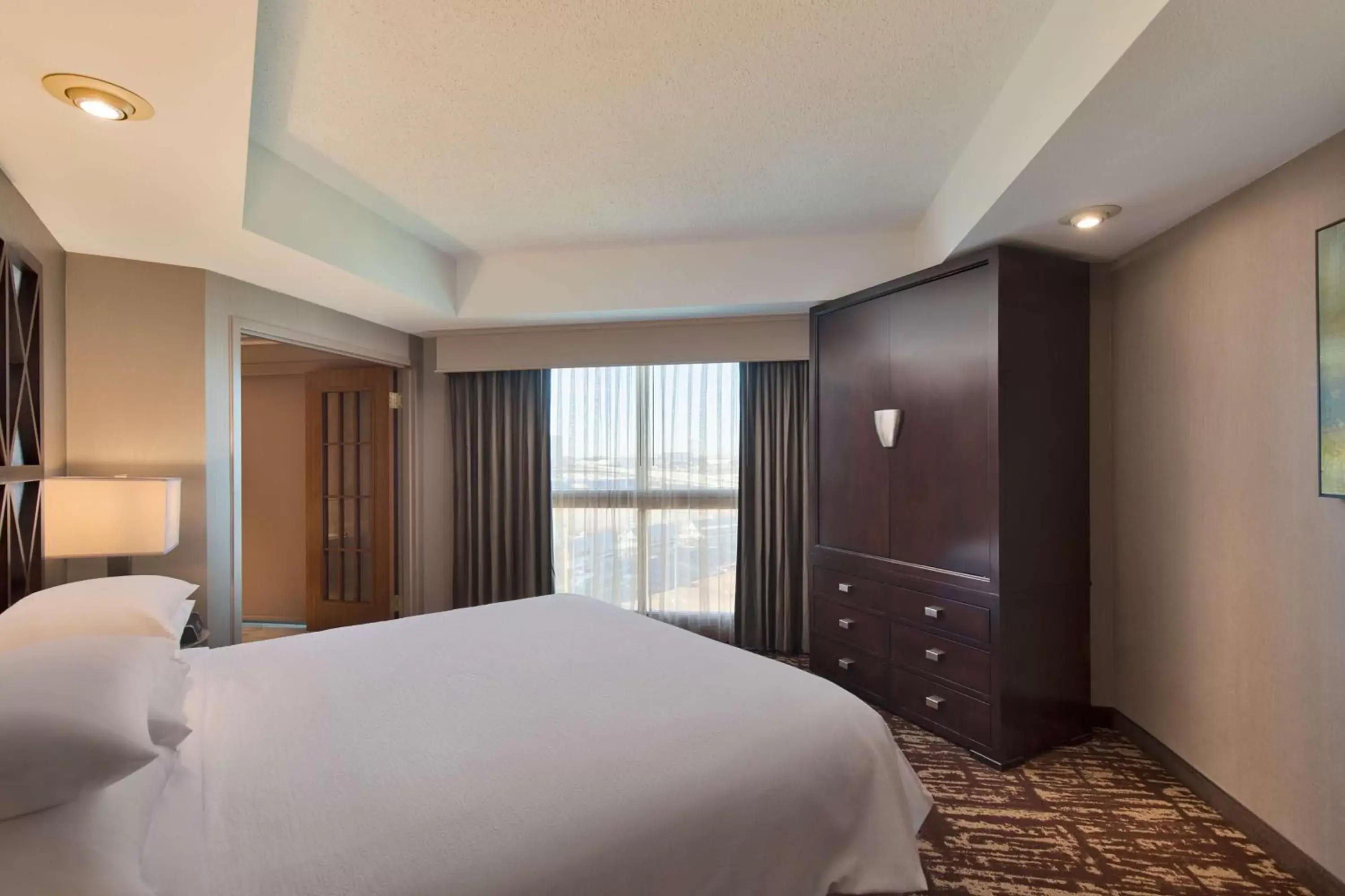 Bed in Embassy Suites by Hilton Dallas Frisco Hotel & Convention Center