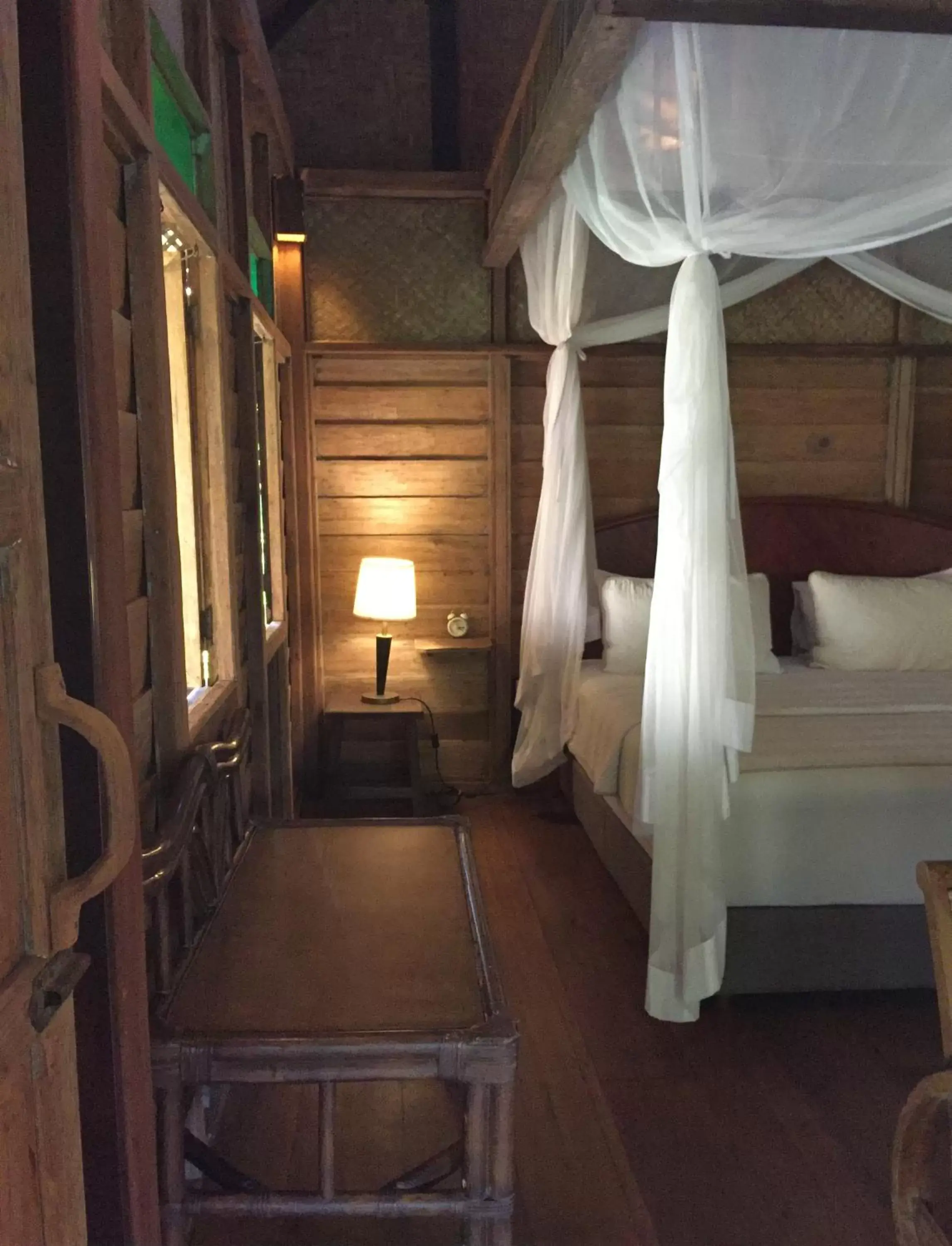 Bed in Kunang Kunang Heritage Villas
