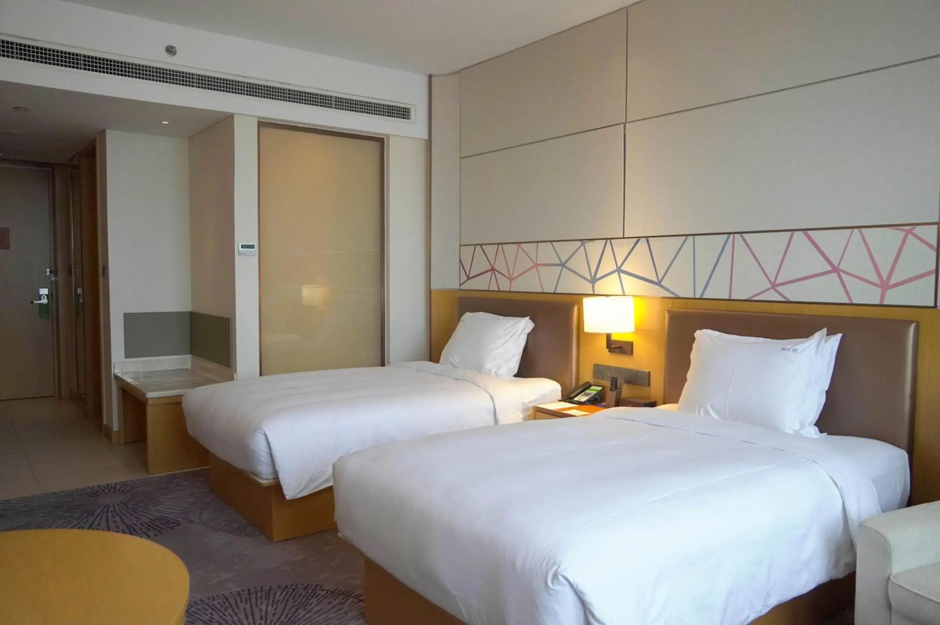 Bed in Holiday Inn Tianjin Xiqing, an IHG Hotel