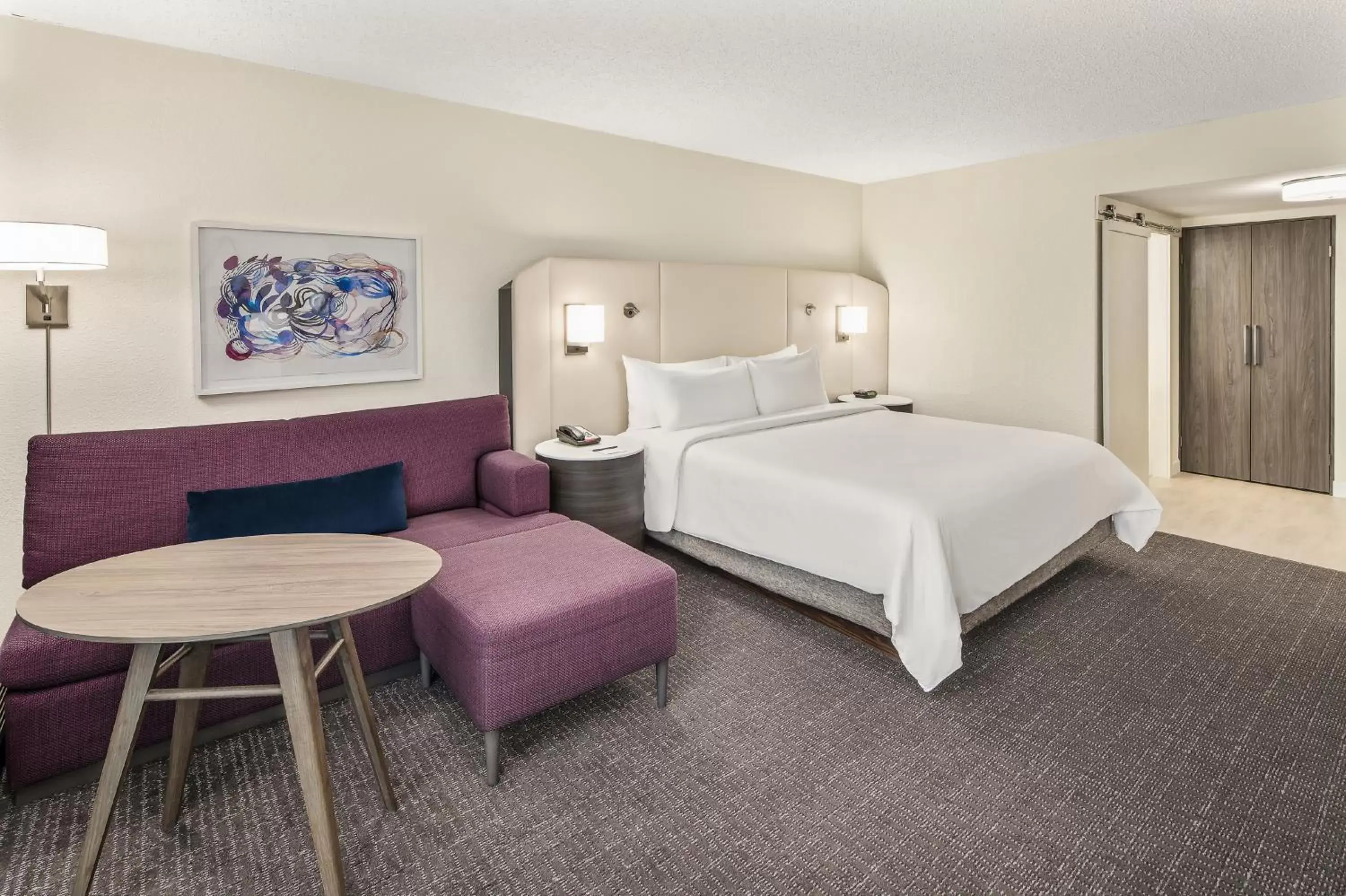 Living room, Bed in Crowne Plaza Orlando - Lake Buena Vista, an IHG Hotel