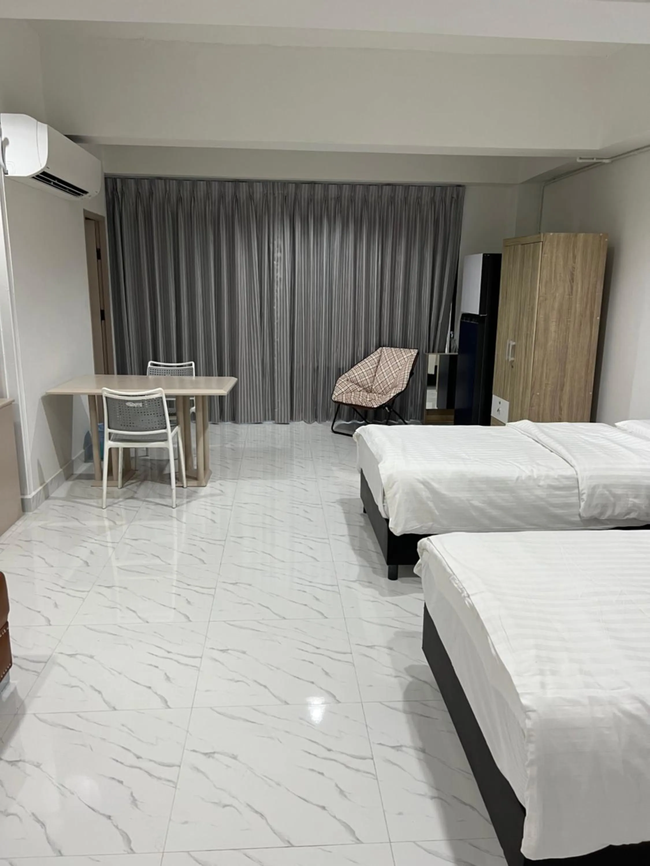 Bed in Mall Suites Hotel