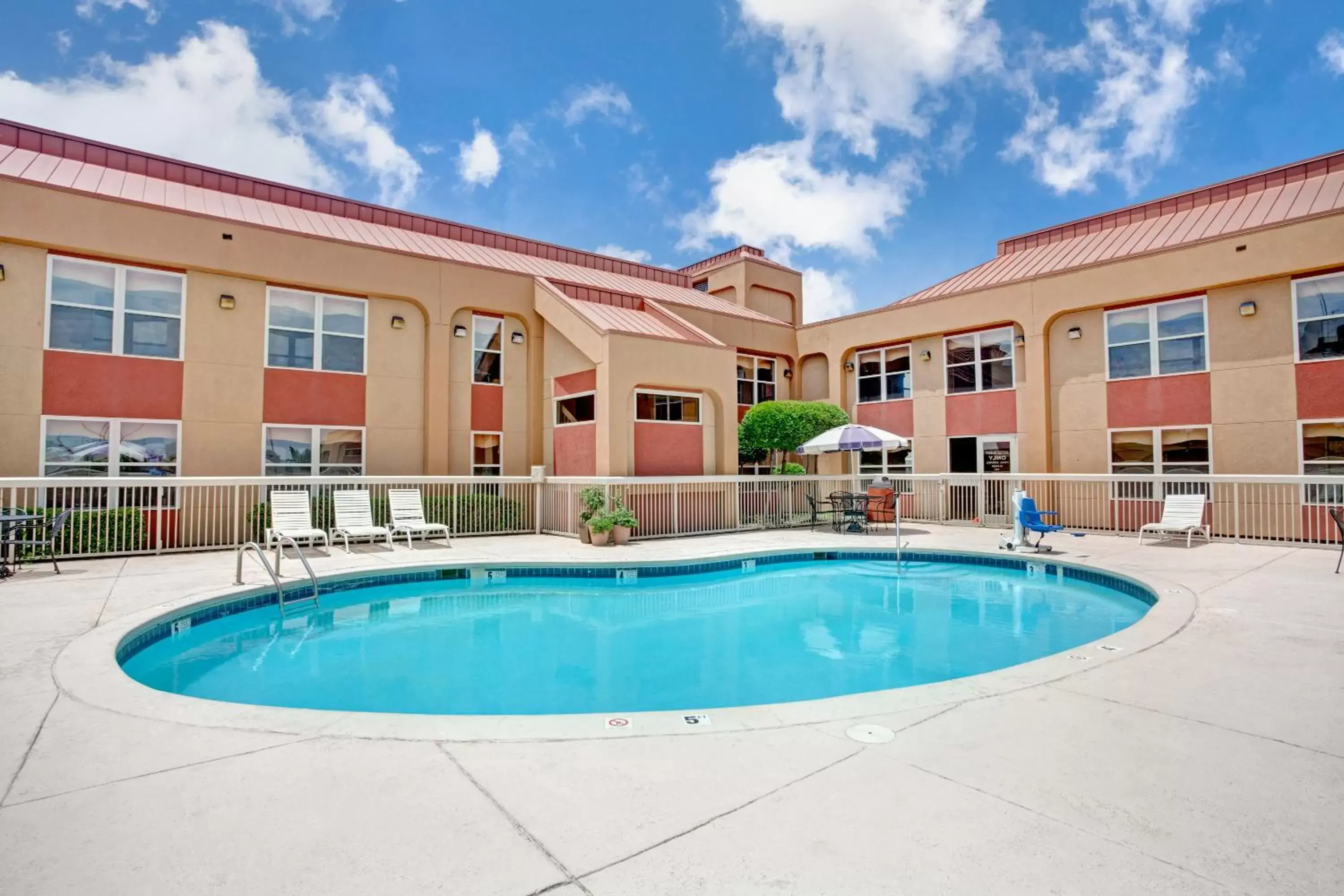 Swimming pool, Property Building in Ramada by Wyndham West Memphis