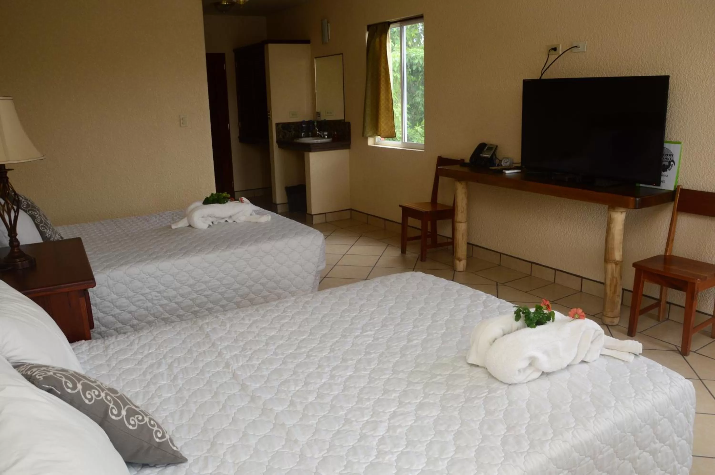 Bed in Lamanai Hotel & Marina