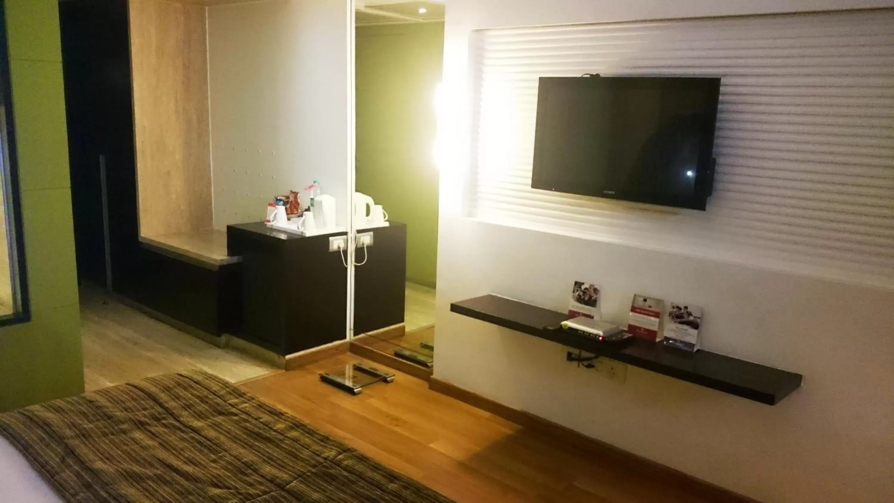 Bedroom, TV/Entertainment Center in Ramada Navi Mumbai