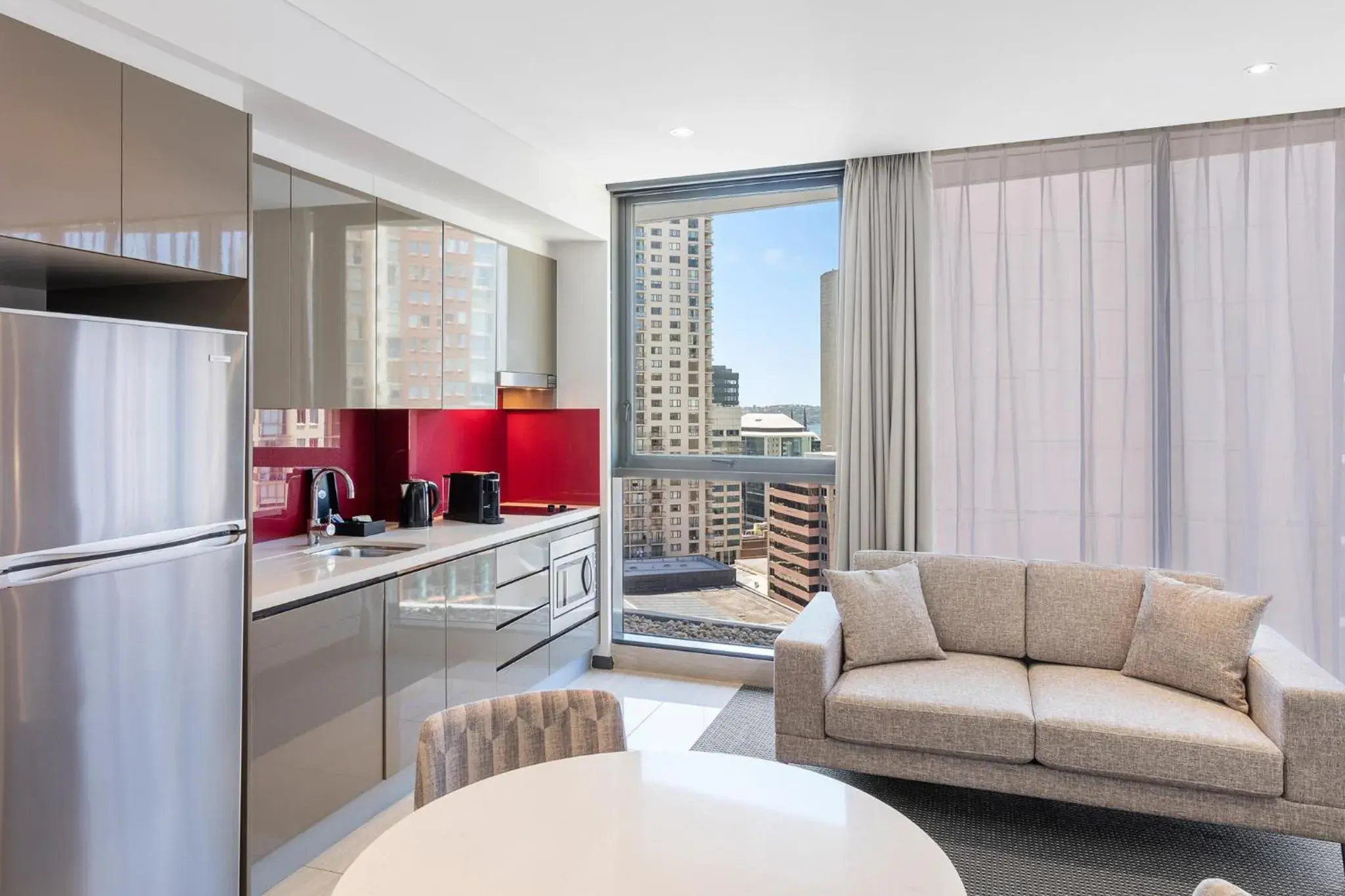 Kitchen or kitchenette, Seating Area in Meriton Suites Campbell Street, Sydney