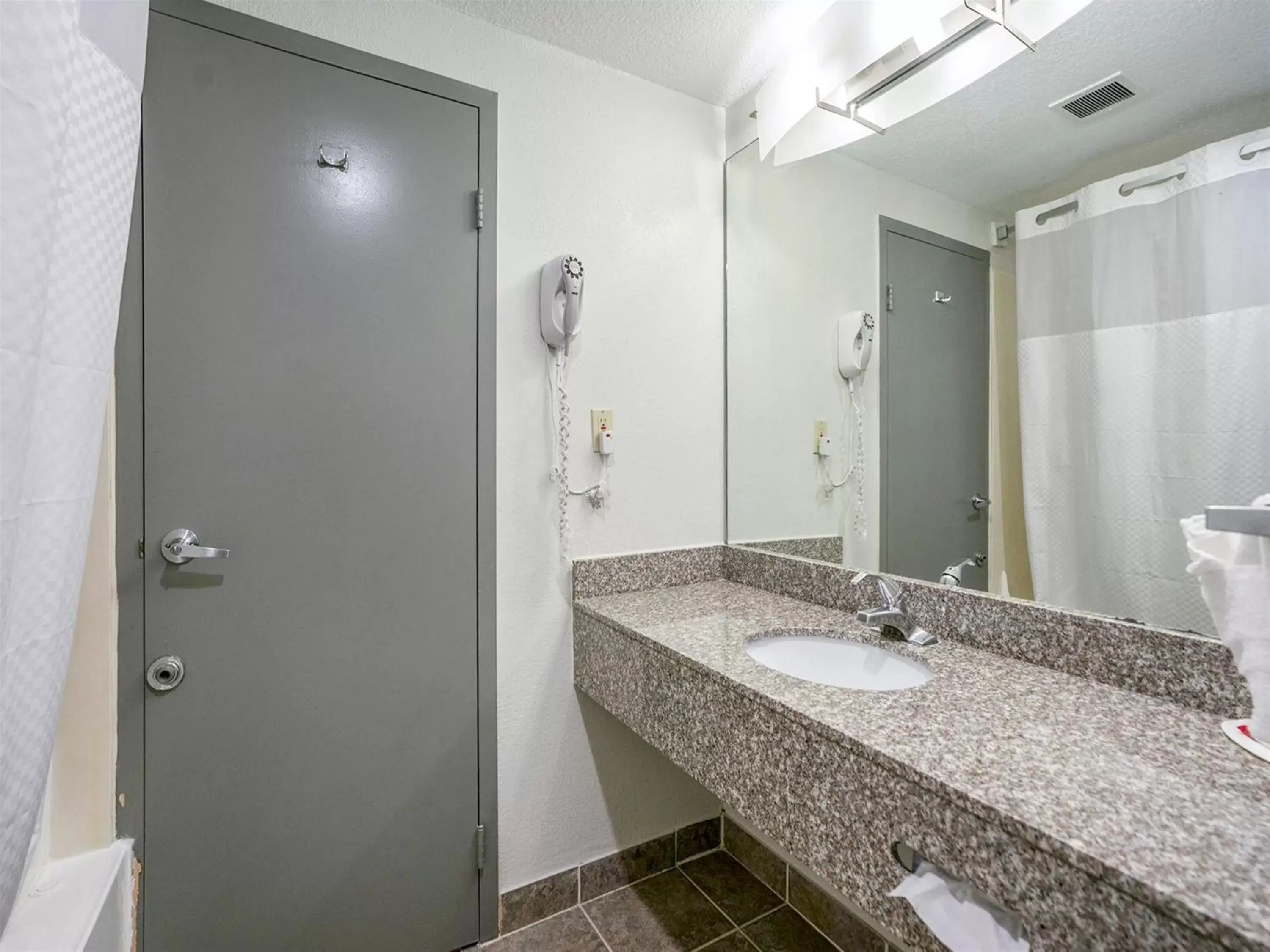 Bathroom in Days Inn & Suites by Wyndham Webster NASA-ClearLake-Houston