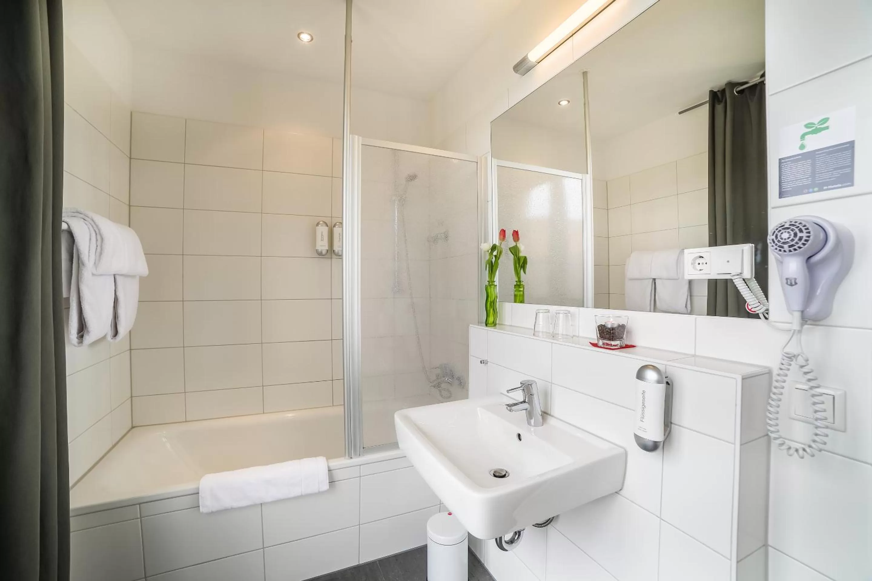 Bathroom in H+ Hotel 4Youth