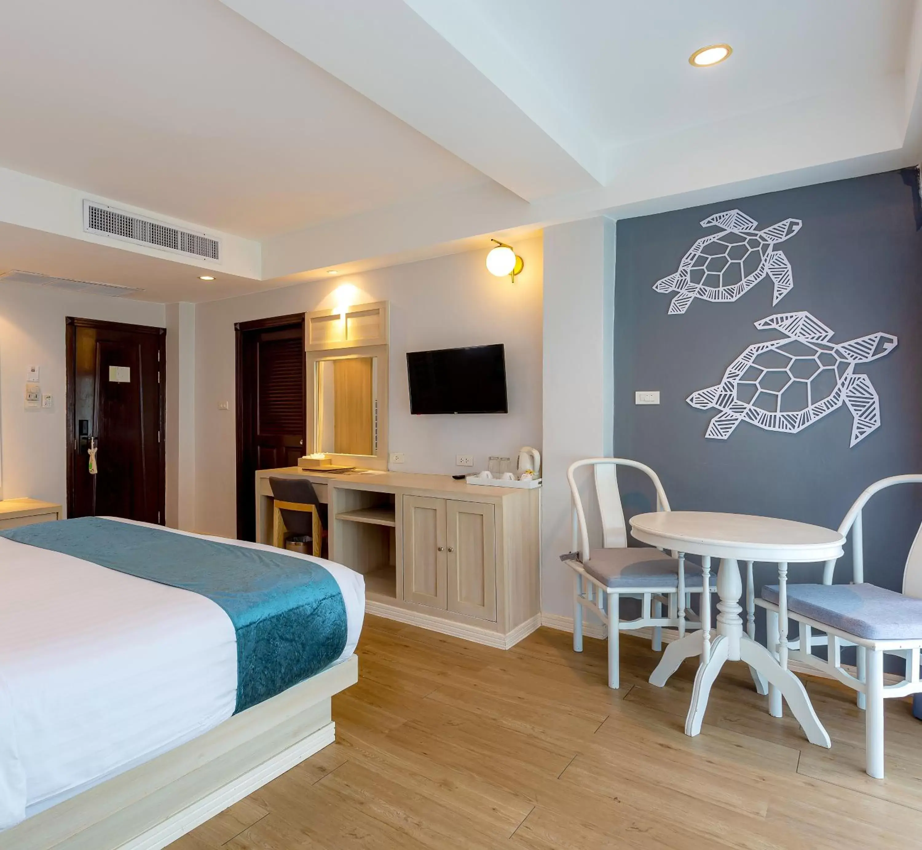 Bed, TV/Entertainment Center in Khaolak Emerald Surf Beach Resort and Spa - SHA Extra Plus