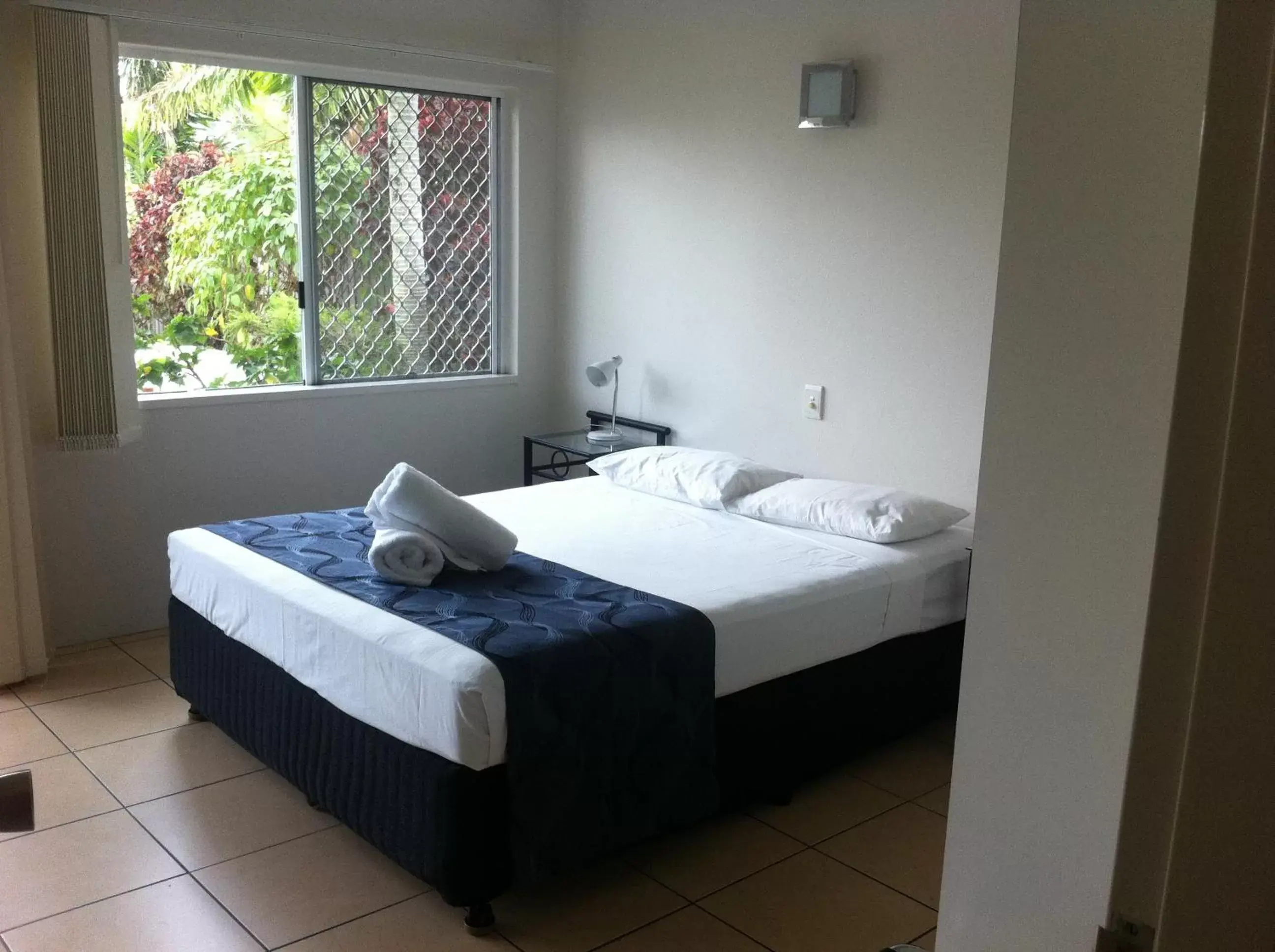 Bed in Reef Gateway Apartments