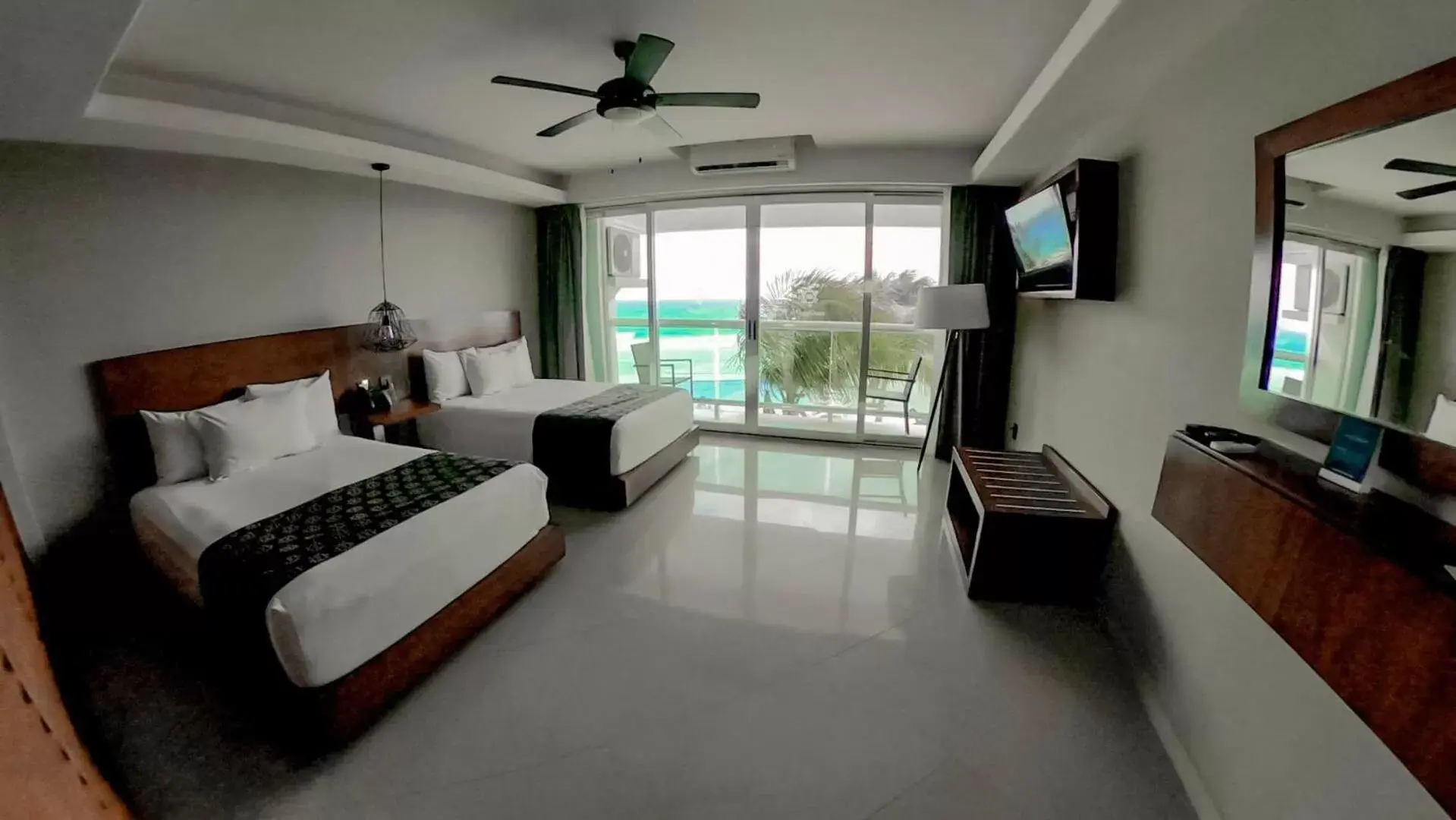 Bed in Ocean Dream Cancun by GuruHotel