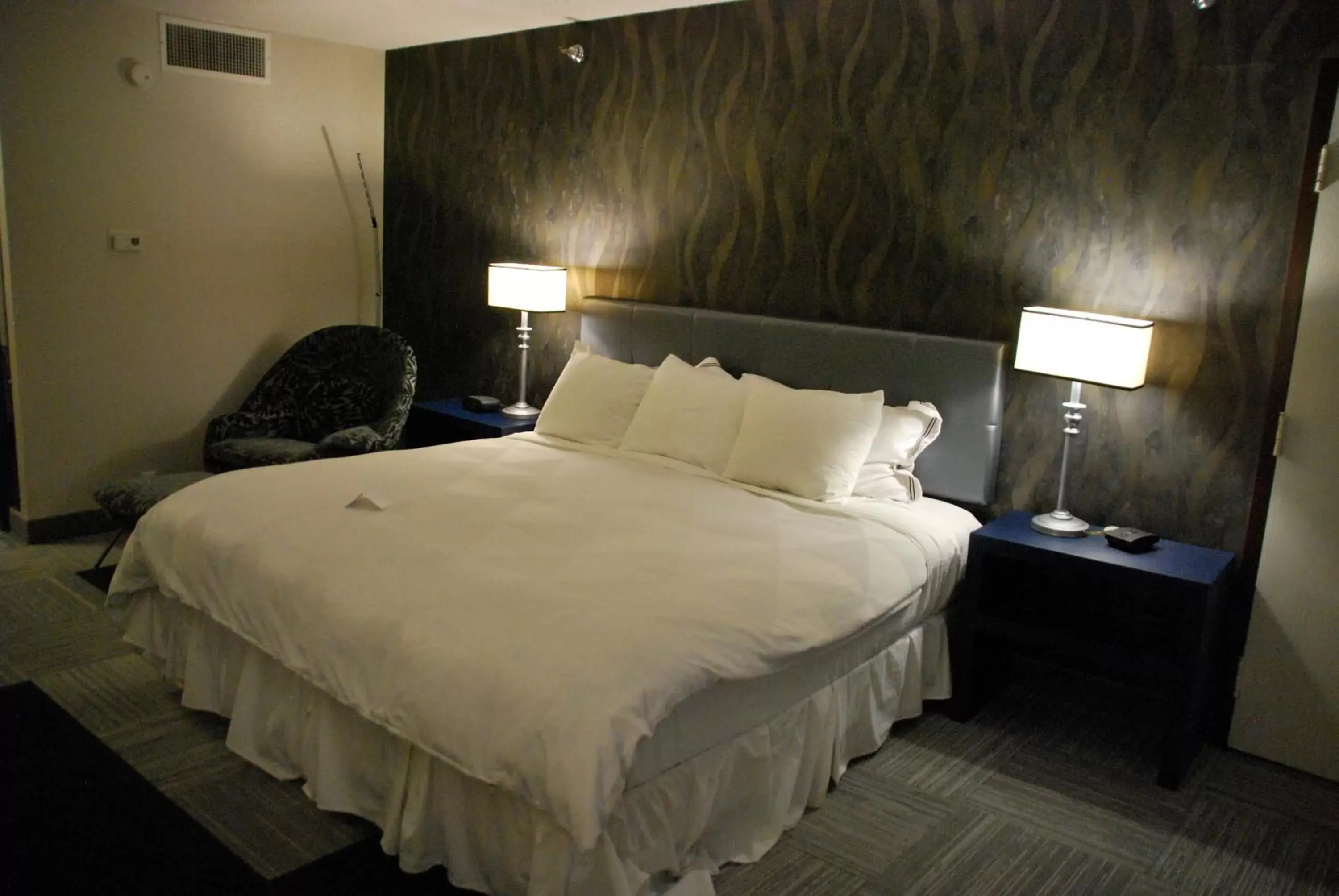 Bed in The Rushmore Hotel & Suites; BW Premier Collection