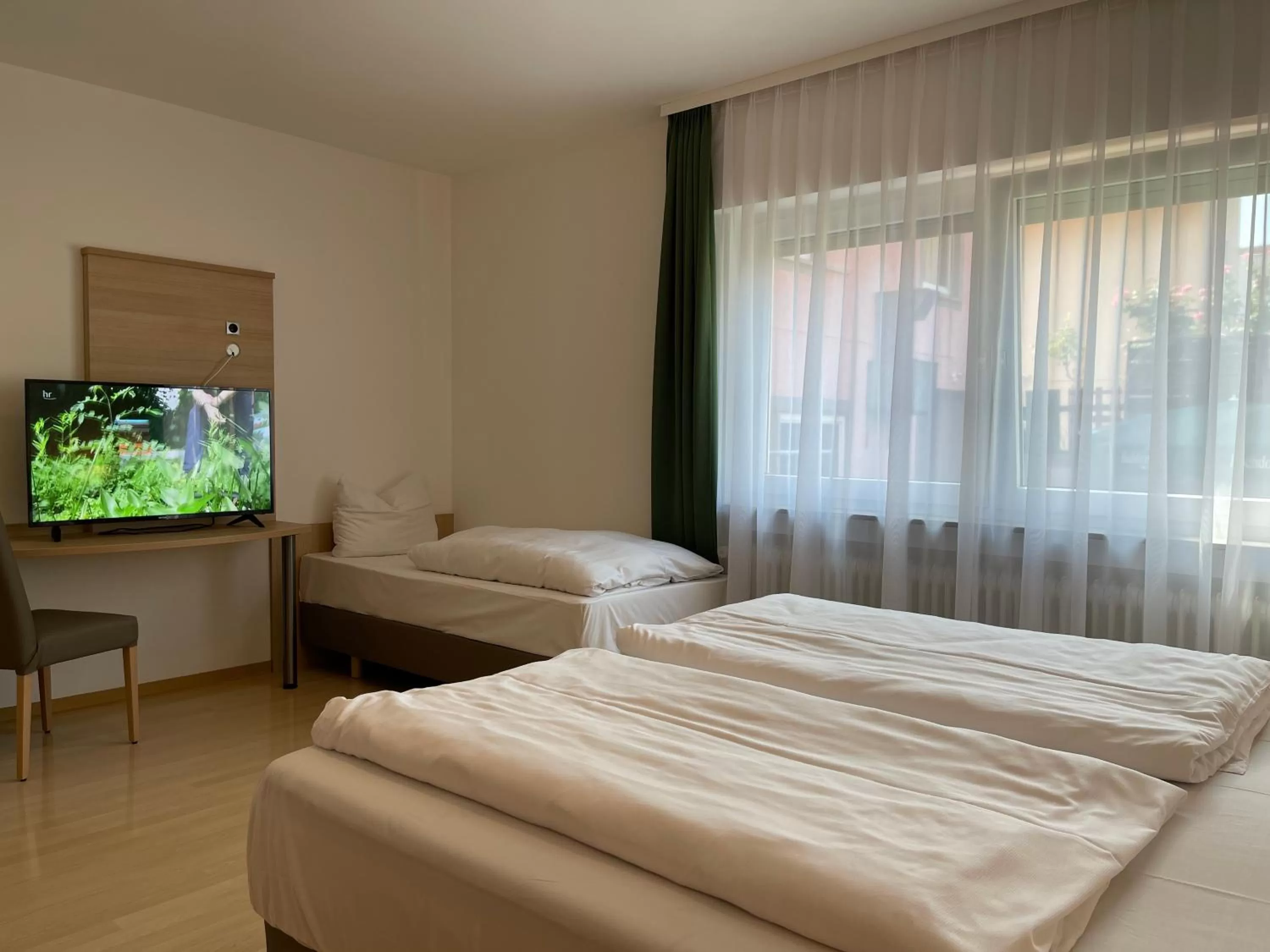 TV and multimedia, Bed in Hafner Hotel- Apartment